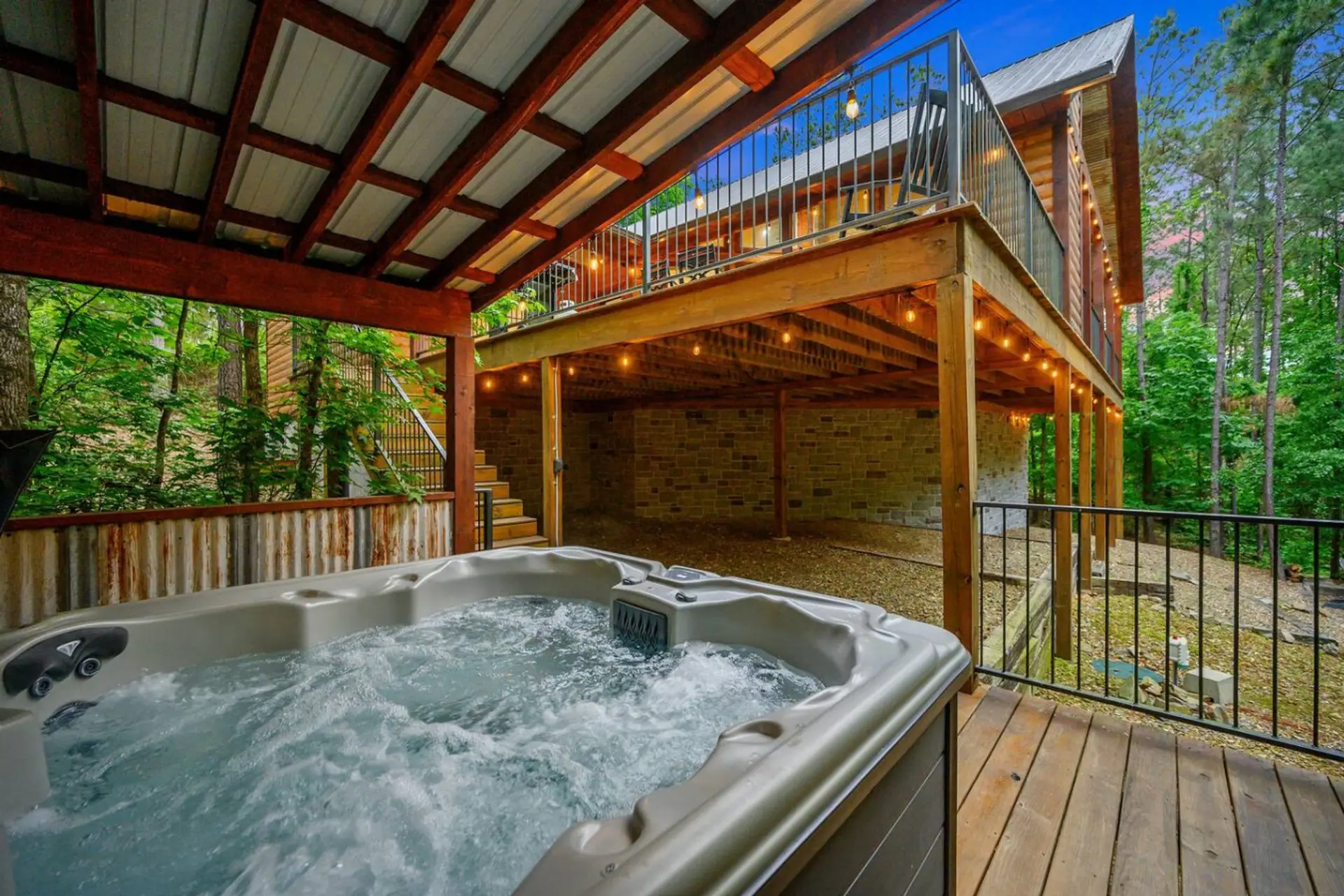Relax and soak beneath the trees and string lights.