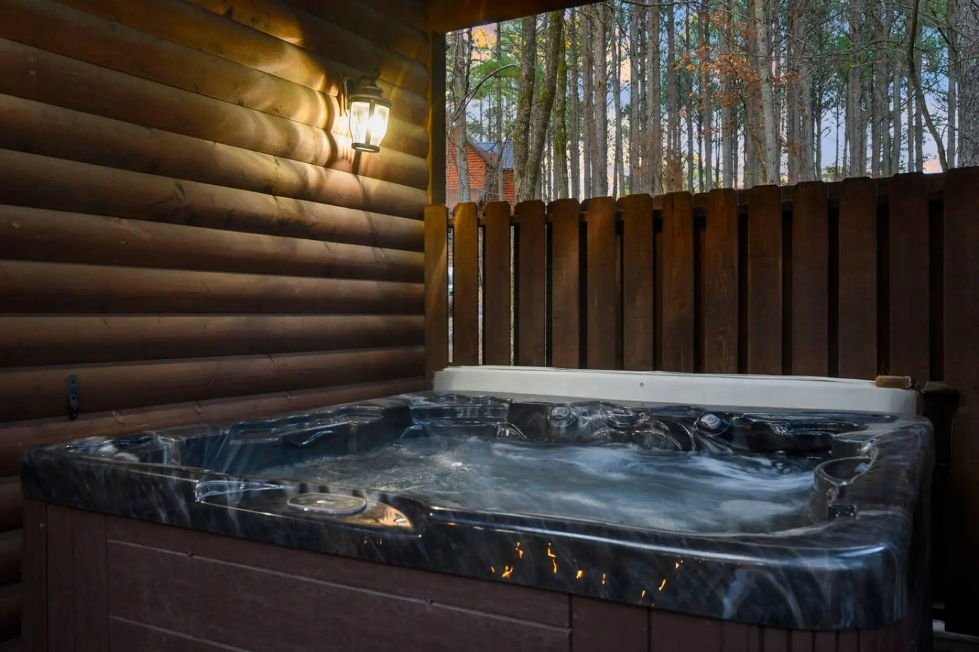 Soak under the stars in your private hot tub surrounded by towering pines and forest views.