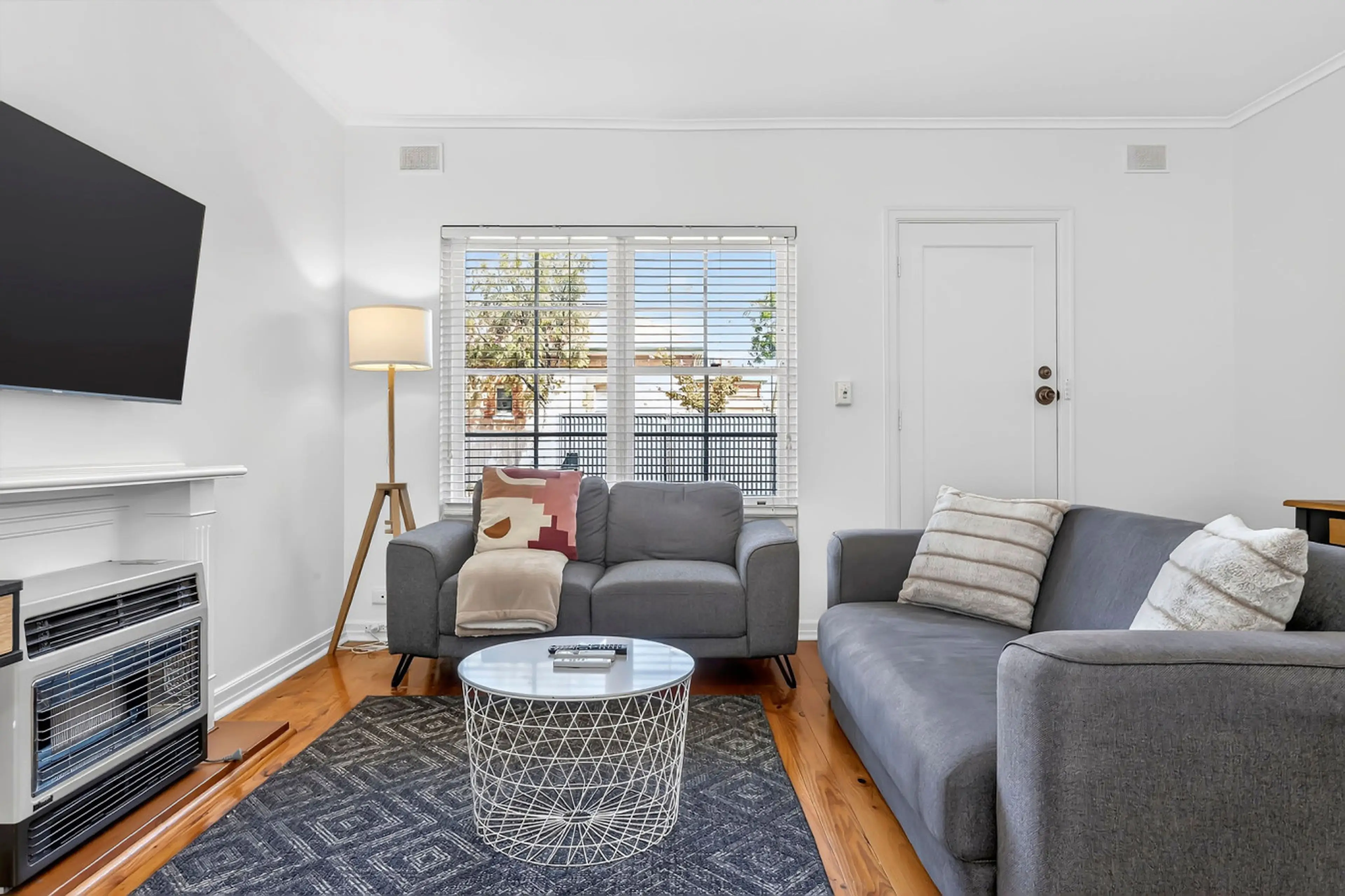 Light-filled living area with comfy seating, perfect for putting your feet up after a day out.
