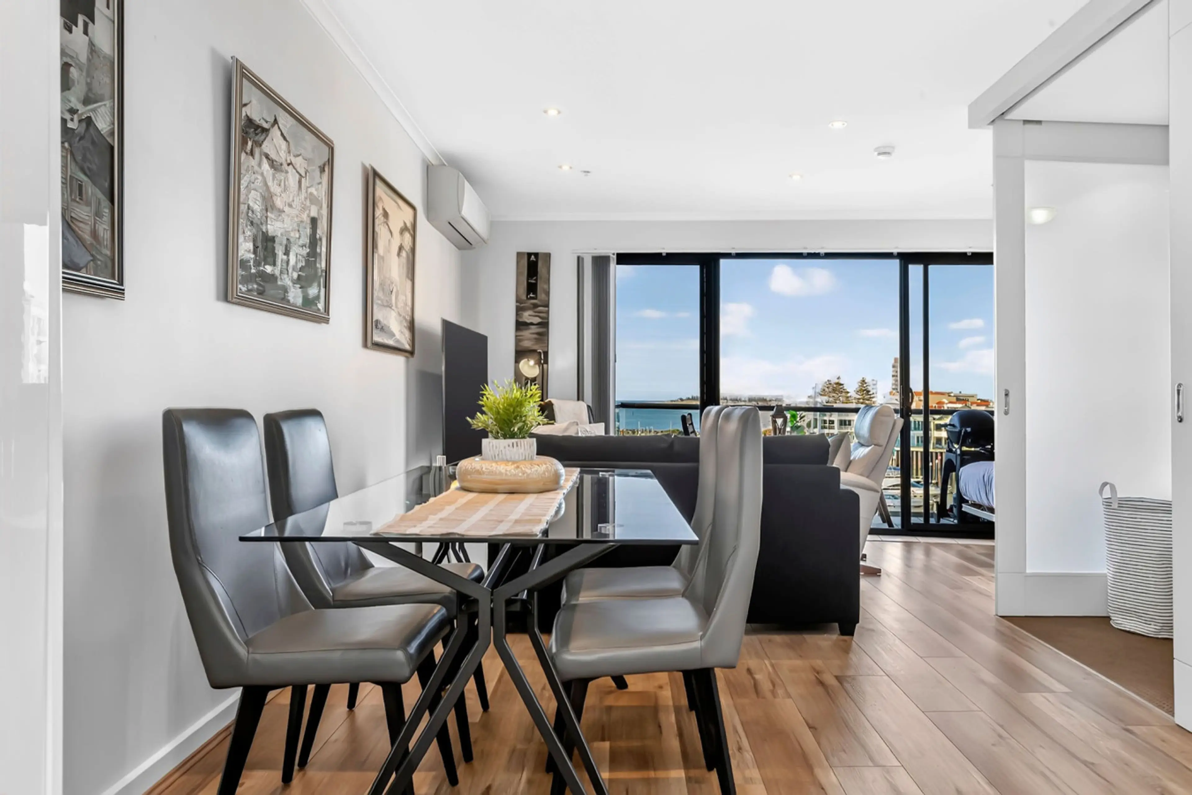 Bright, open dining with a stunning coastal backdrop