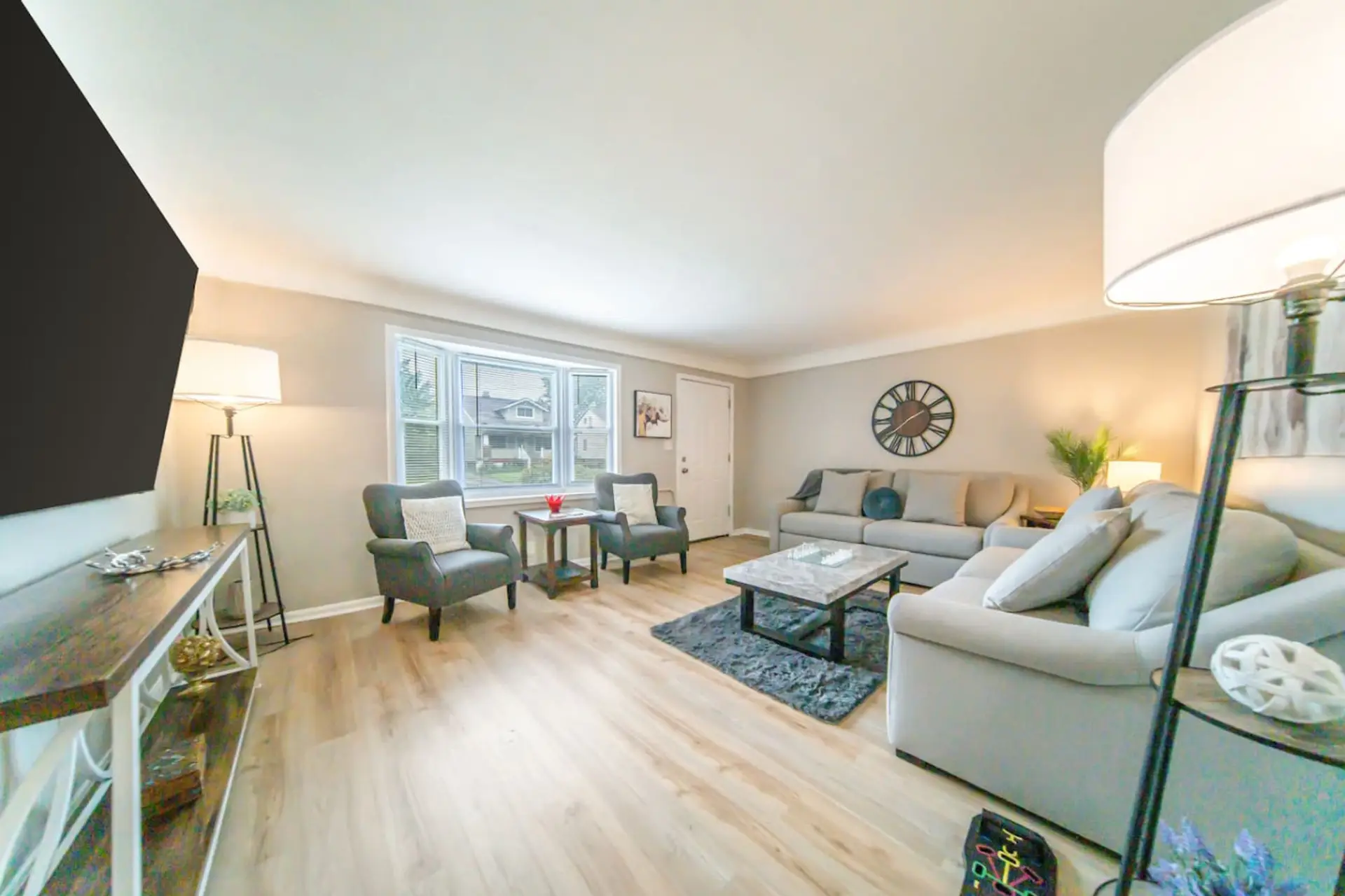 Designed for togetherness, the spacious living room flows seamlessly into the rest of the home, offering an inviting spot to gather for conversation or catch the big game.