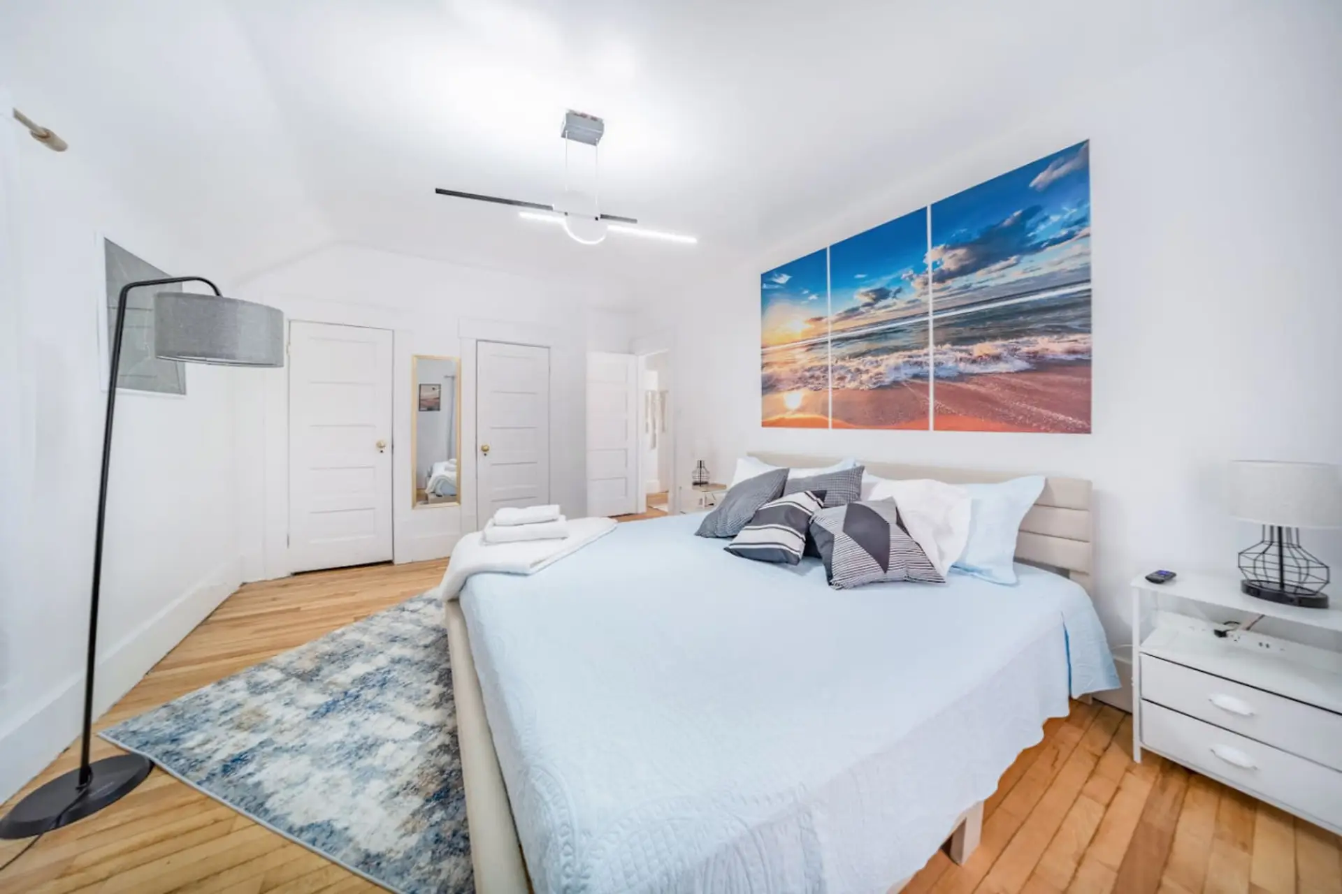 Step into a bright and tranquil sanctuary in Bedroom 1, where coastal charm meets modern comfort. This spacious retreat features a plush King-size bed perfectly positioned across from a wall-mounted flat-screen TV for relaxing movie nights.