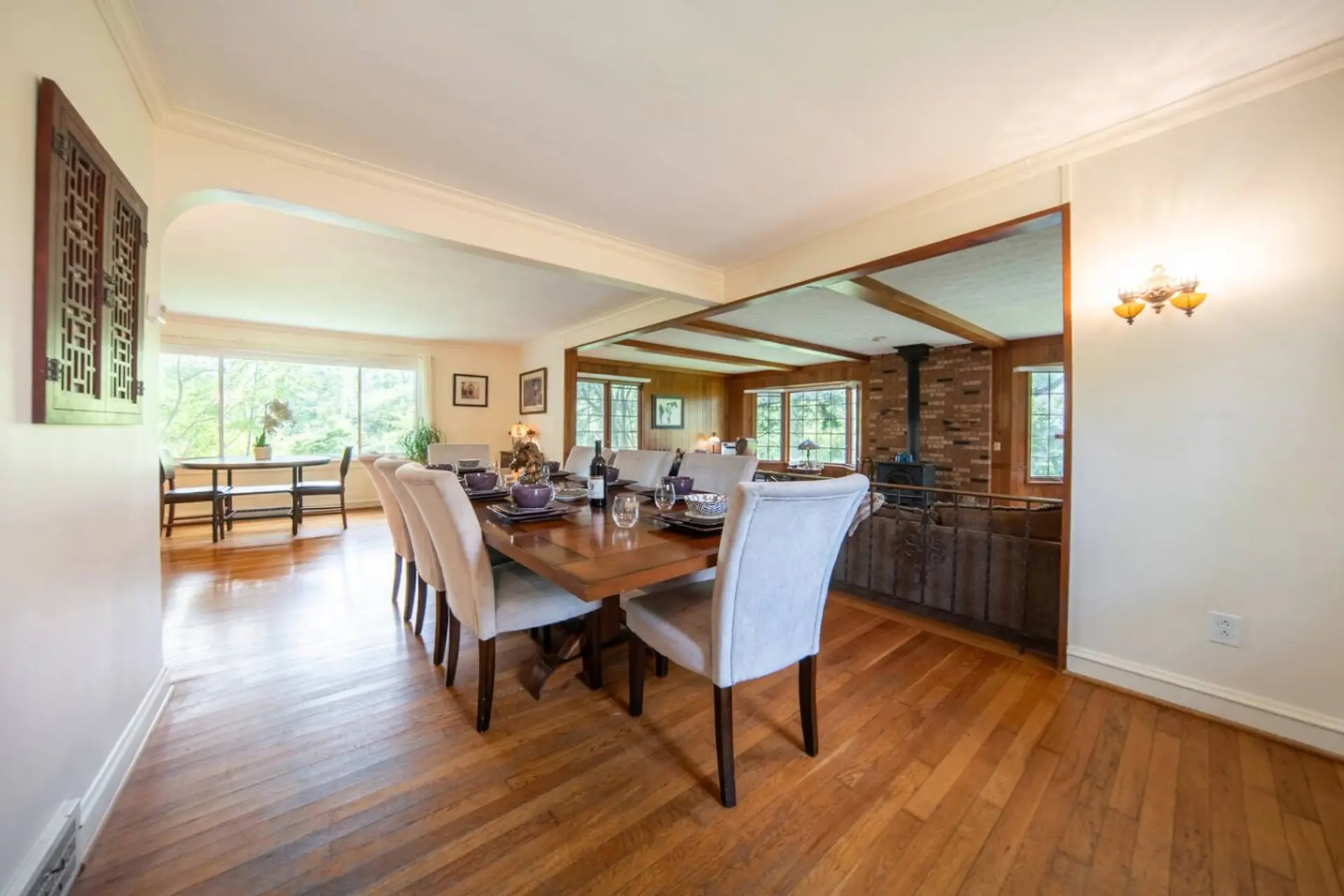 Enjoy your meals in this dedicated dining space, featuring a warm wooden table and plenty of seating for family and friends.