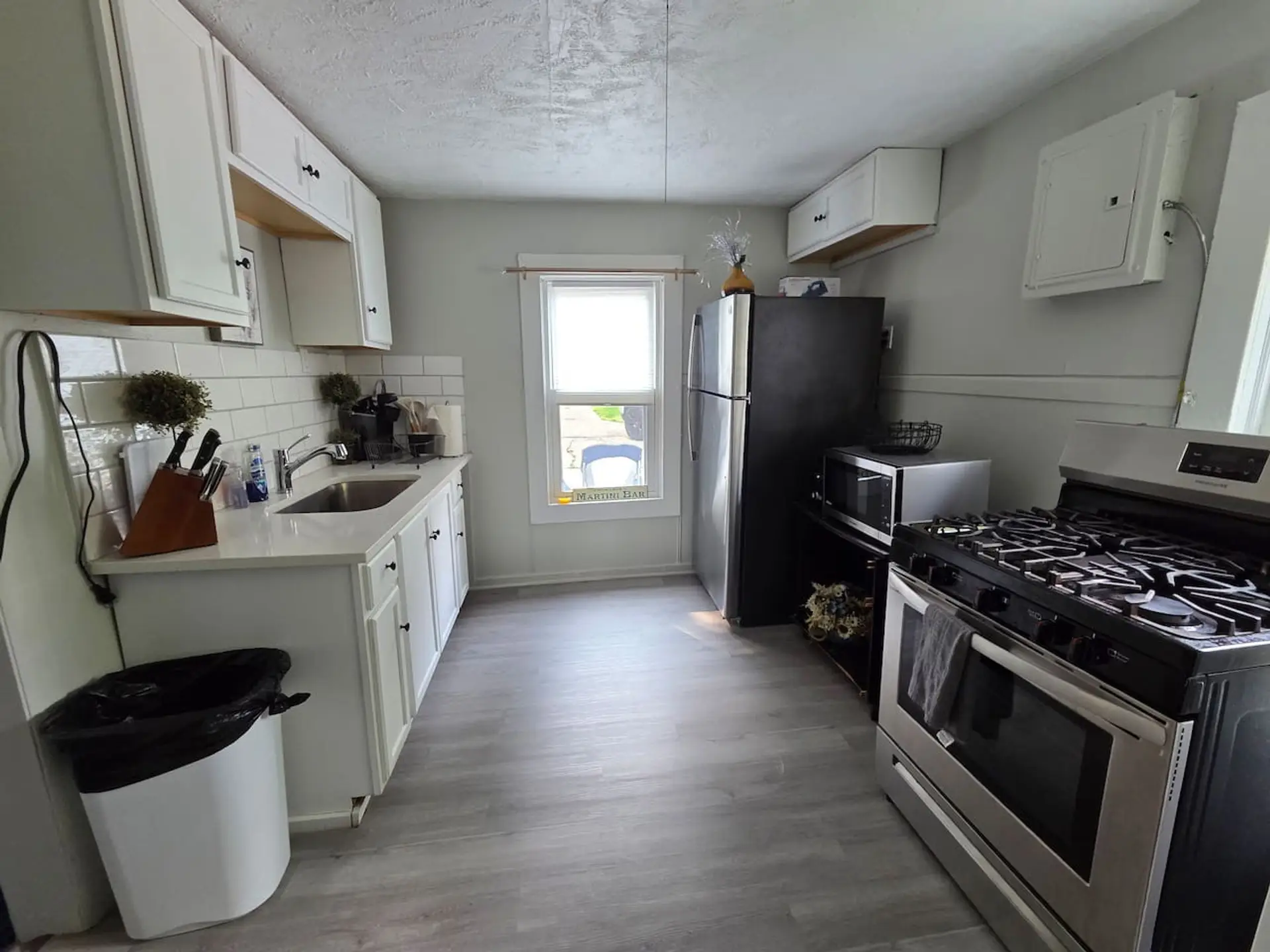 Modern Kitchen for Easy Living. With fresh white cabinets and stainless steel appliances, this space is both stylish and functional. Perfectly set up to fuel your group for a day of exploring.