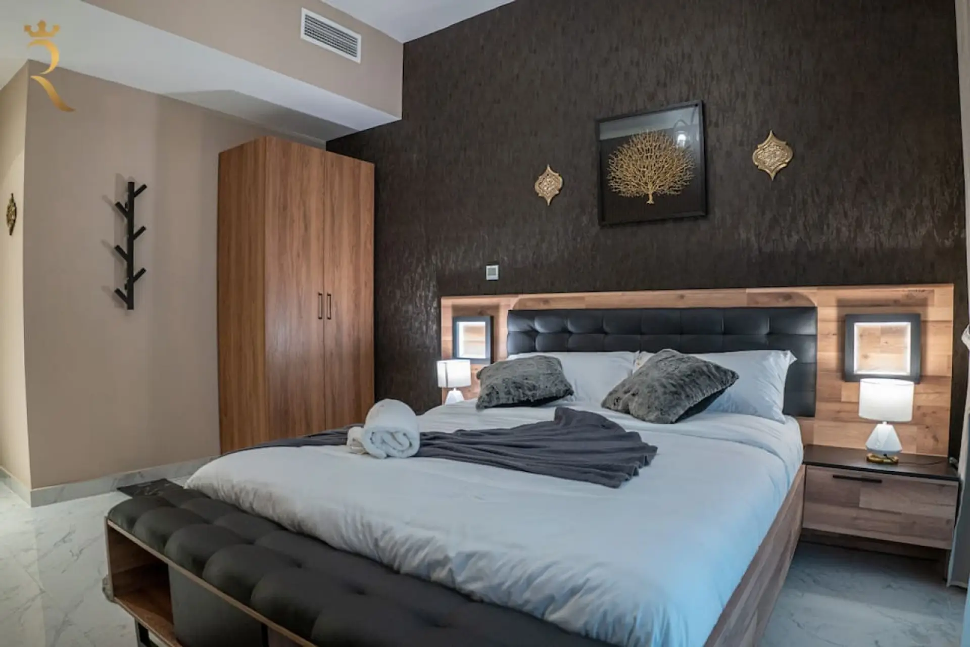 Elevate your stay with a touch of luxury in our opulent bedroom.