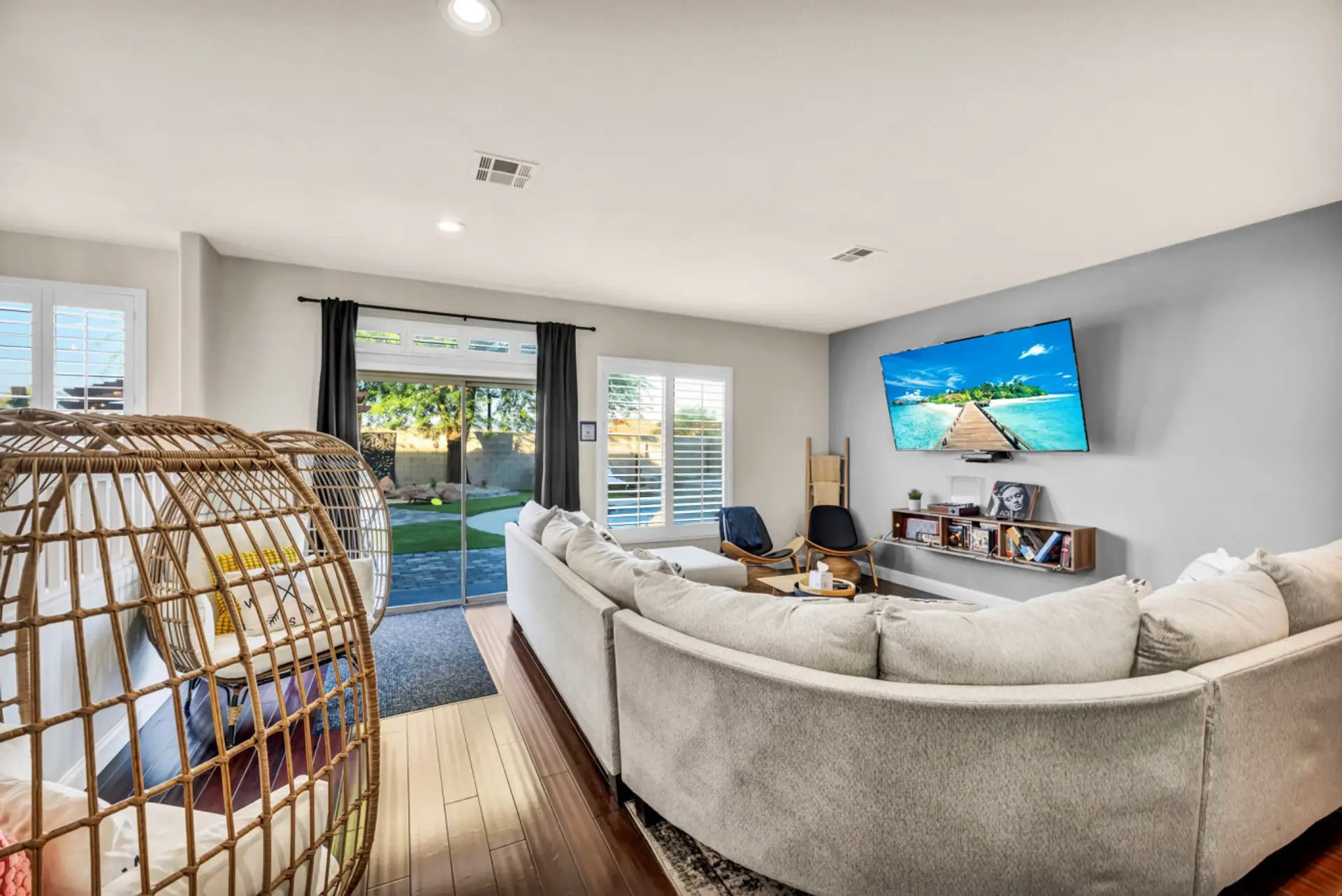 Beautiful Living room with comfy sitting, HD TV, DVDs, Record player and more