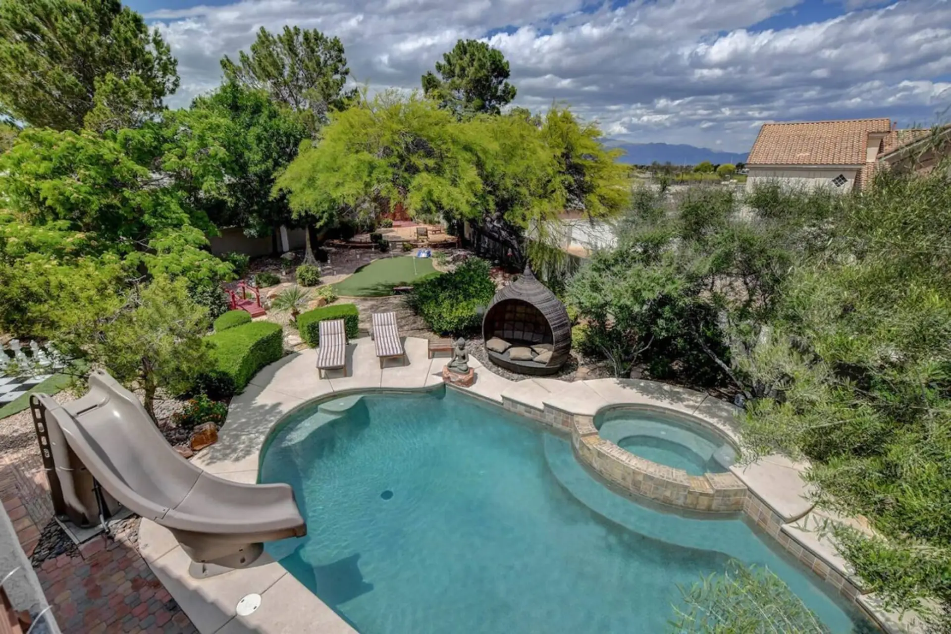 Resort-style luxury with a pool, waterslide, hot tub, mini golf, and steam sauna. The perfect escape for fun, relaxation, and indulgence