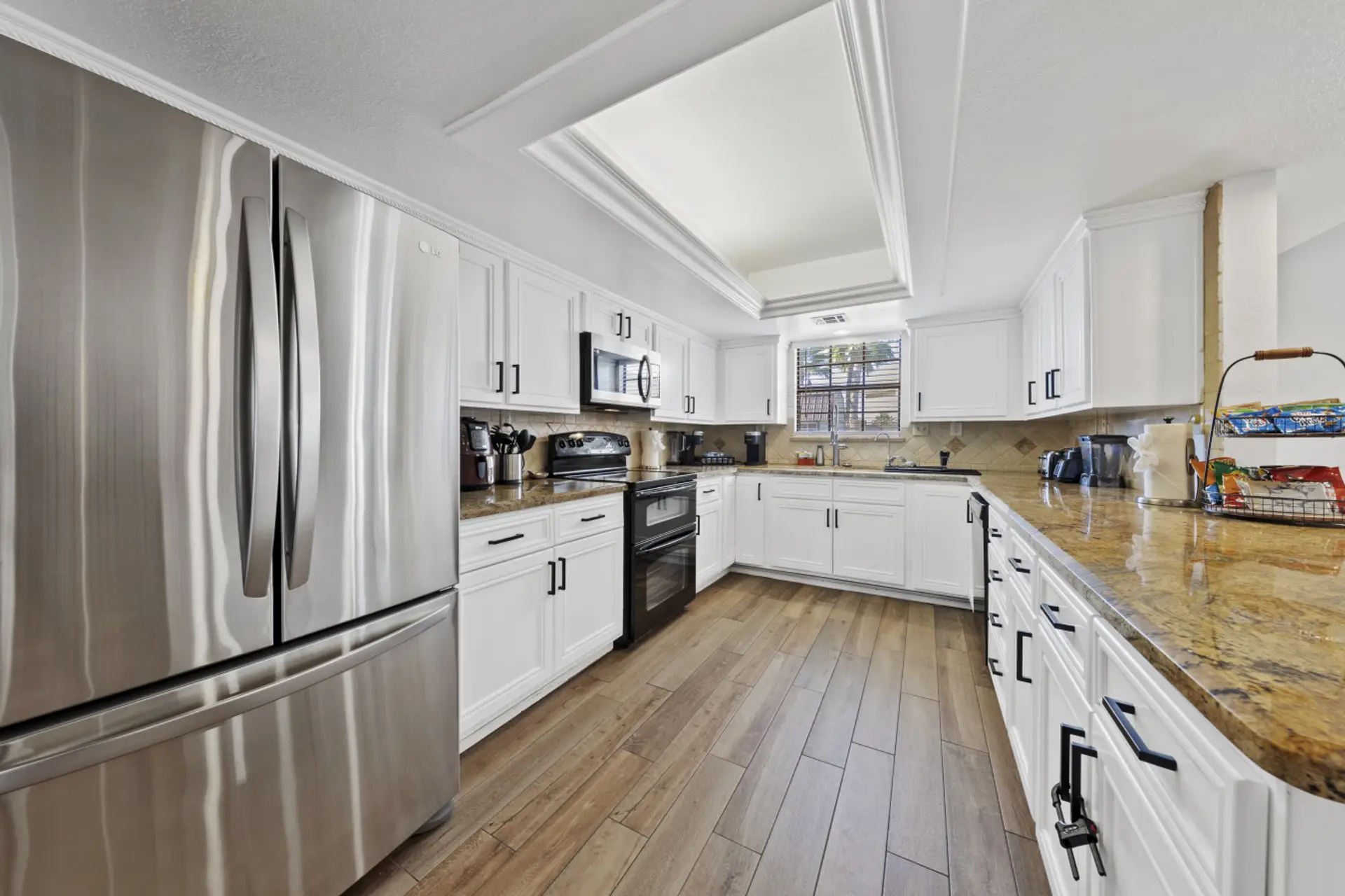 Enjoy creating culinary memories in our chef's kitchen, fully-equipped with modern appliances and all the cooking essentials. Perfect for preparing family meals or morning coffee together.