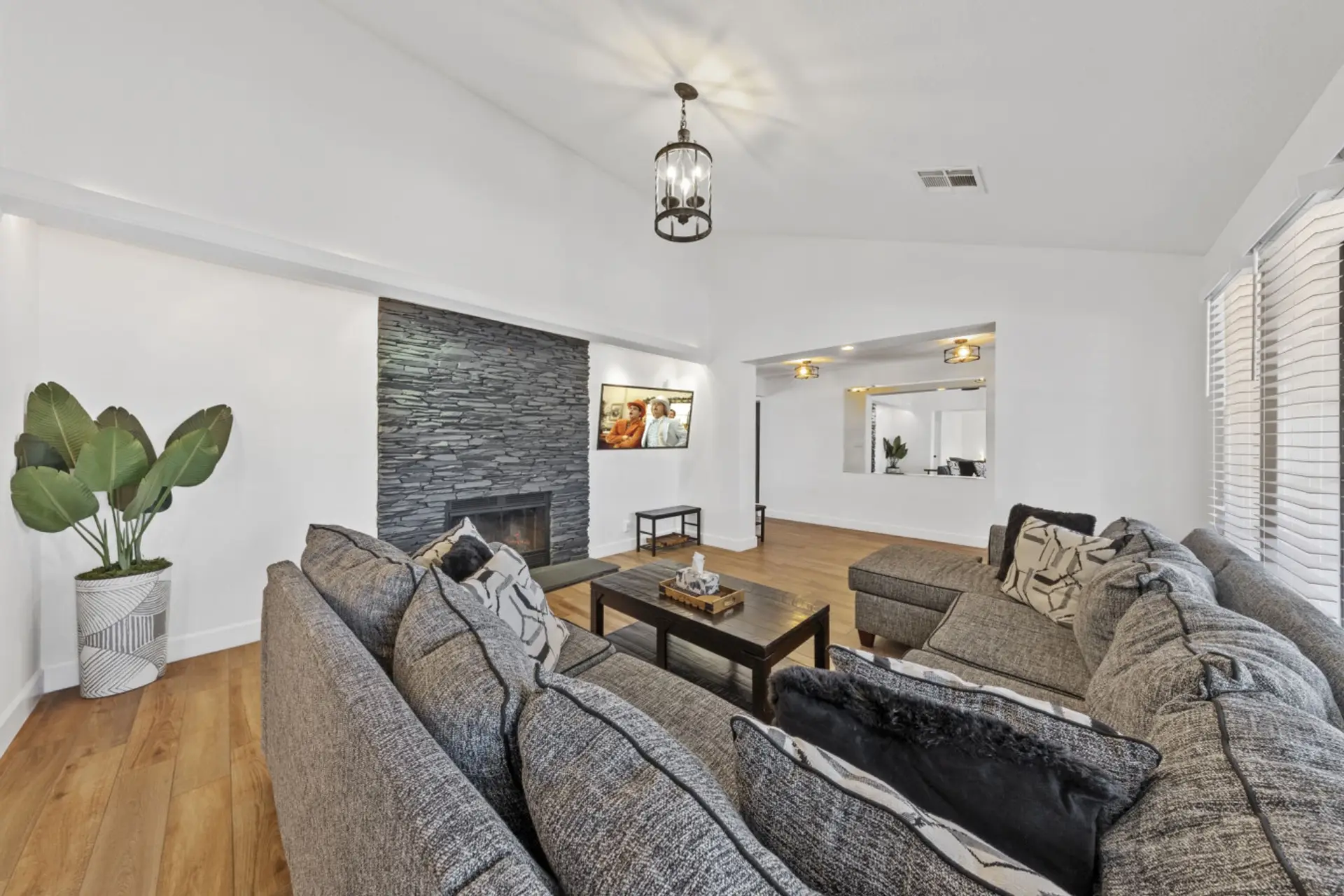 Enjoy relaxing in our bright, comfortable living room with plenty of natural light streaming in. Gather with loved ones to watch your favorite shows on the HD smart TV—the perfect spot to unwind together