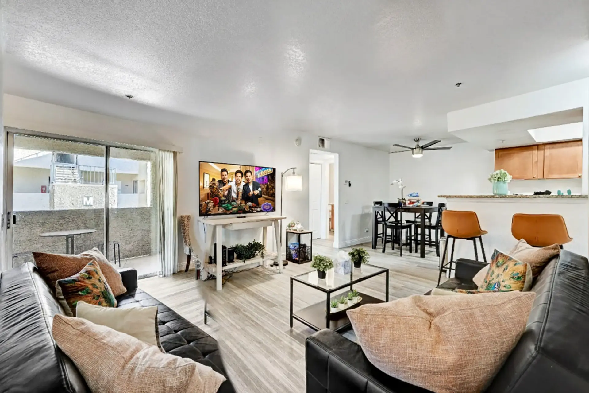 Relax in a cozy living room with soft seating, warm lighting, and space to unwind