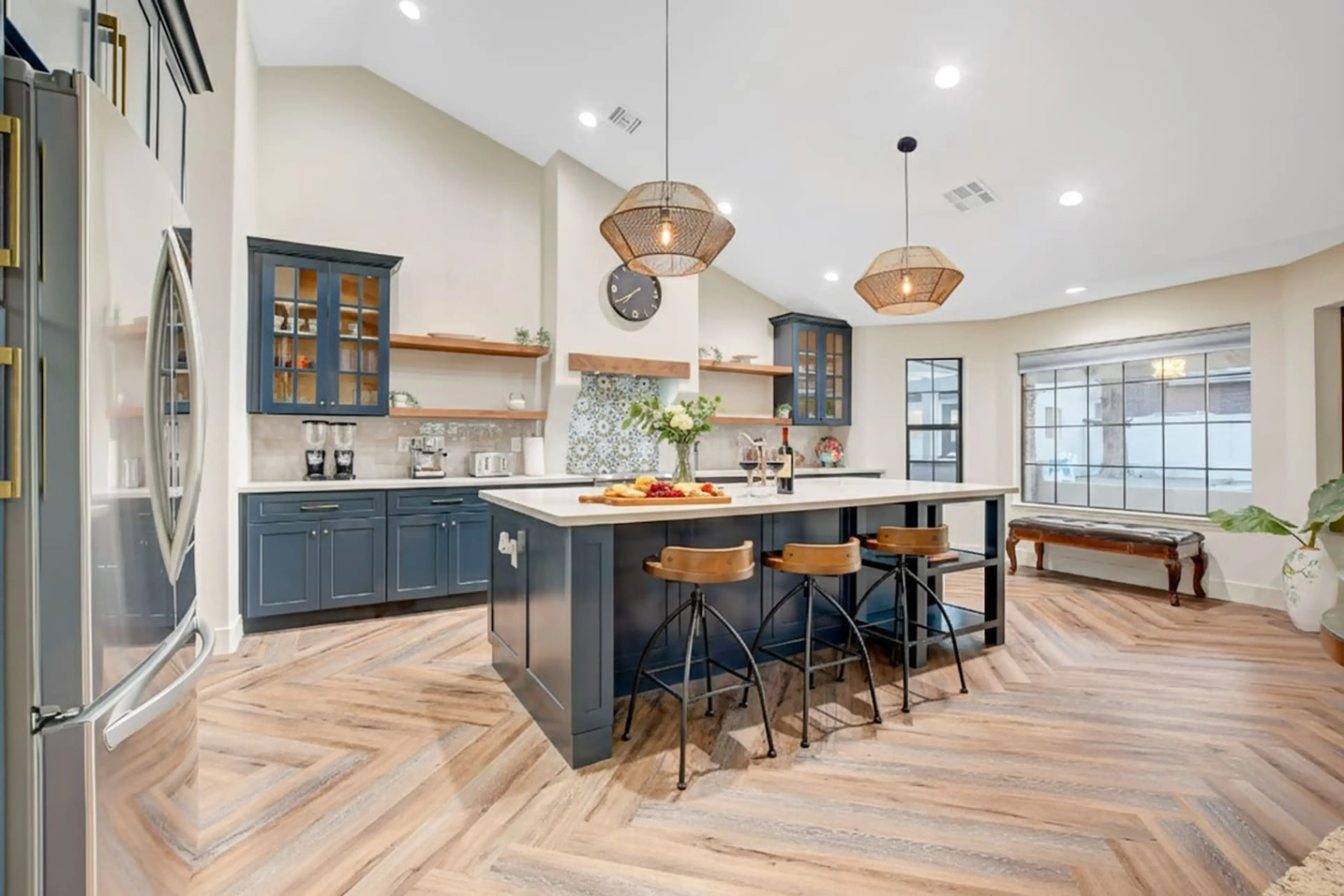 This spectacular, open-concept kitchen combines high-end modern amenities with a warm, welcoming design, making it the perfect spot to gather, cook, and entertain.