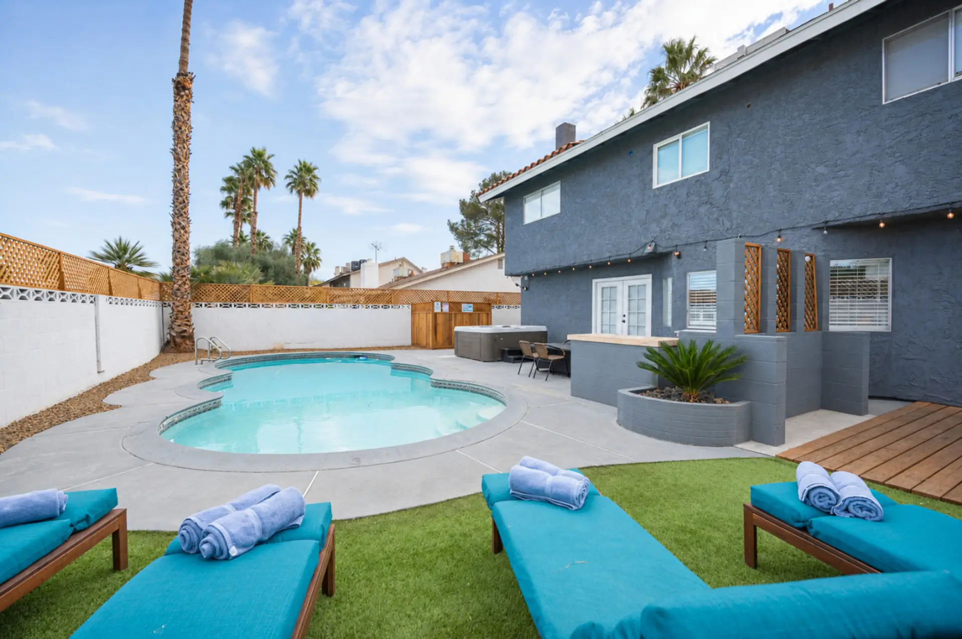 Back yard is full of surprises - Beautiful Pool, Hot tub, Mini golf, Corn Hole, BBQ Grill, Outdoor dining and more...