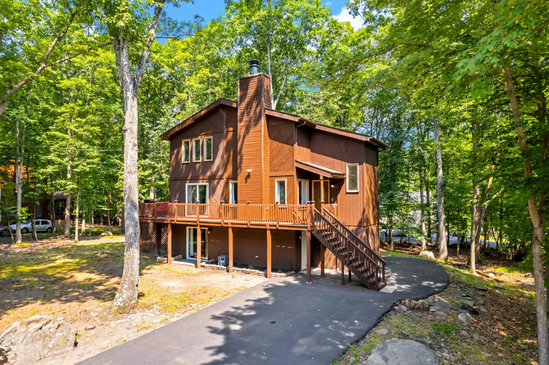 Welcome to your private Poconos retreat, surrounded by peaceful woods with parking for up to 6 vehicles.
