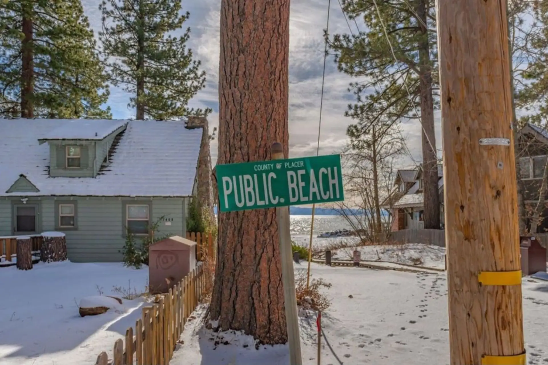 Street Sign displaying location of beach