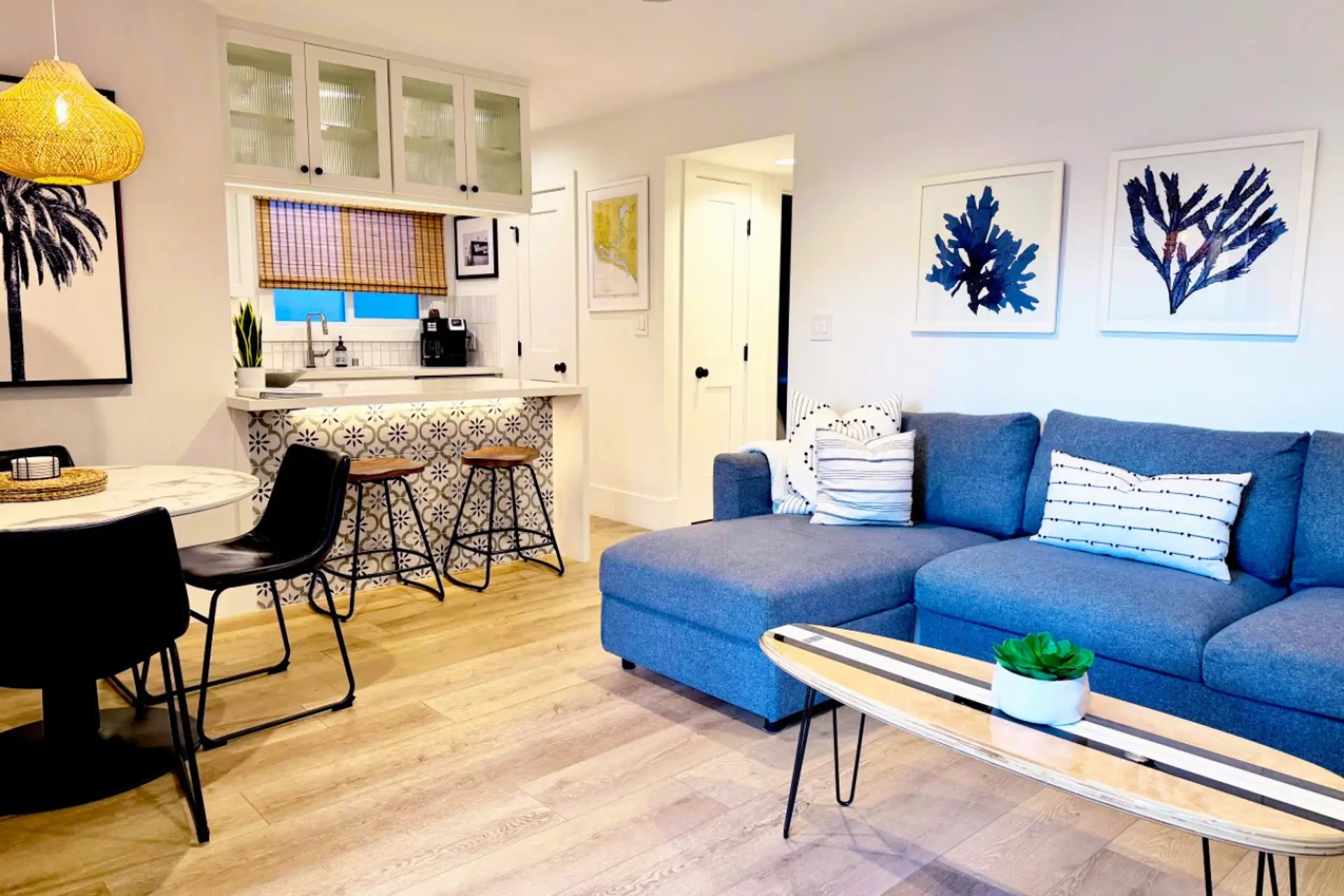 Unwind in our designer living space featuring powerful, quiet A/C and a 85” TV—perfect for cooling off after a day at the beach.