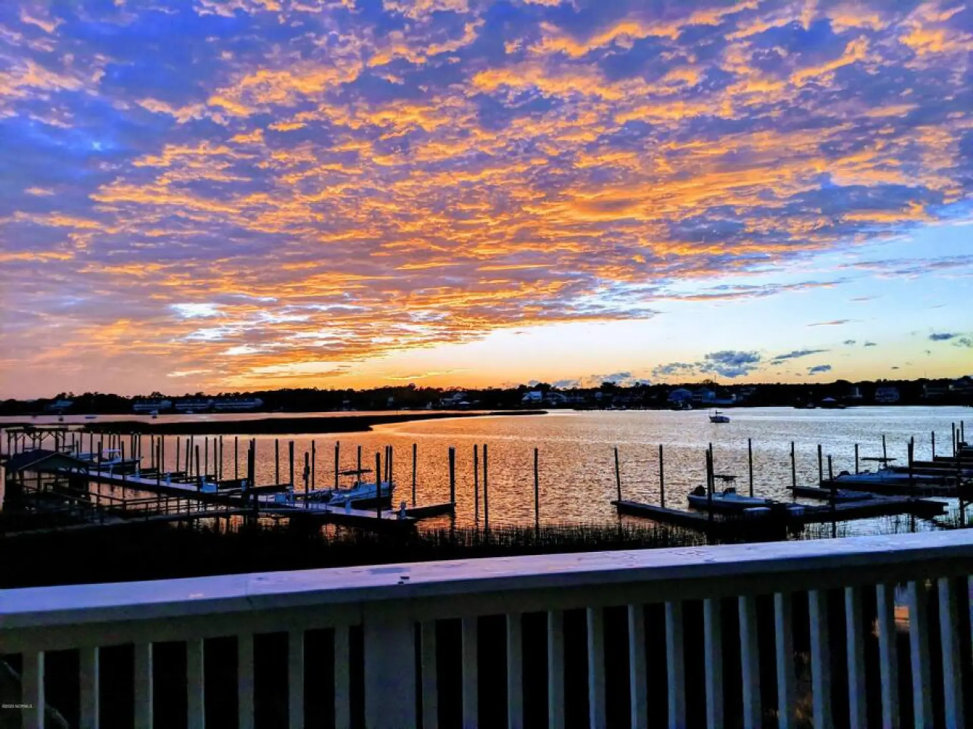 Canal-front views + your private 30’ boat slip—this is what makes this home special.