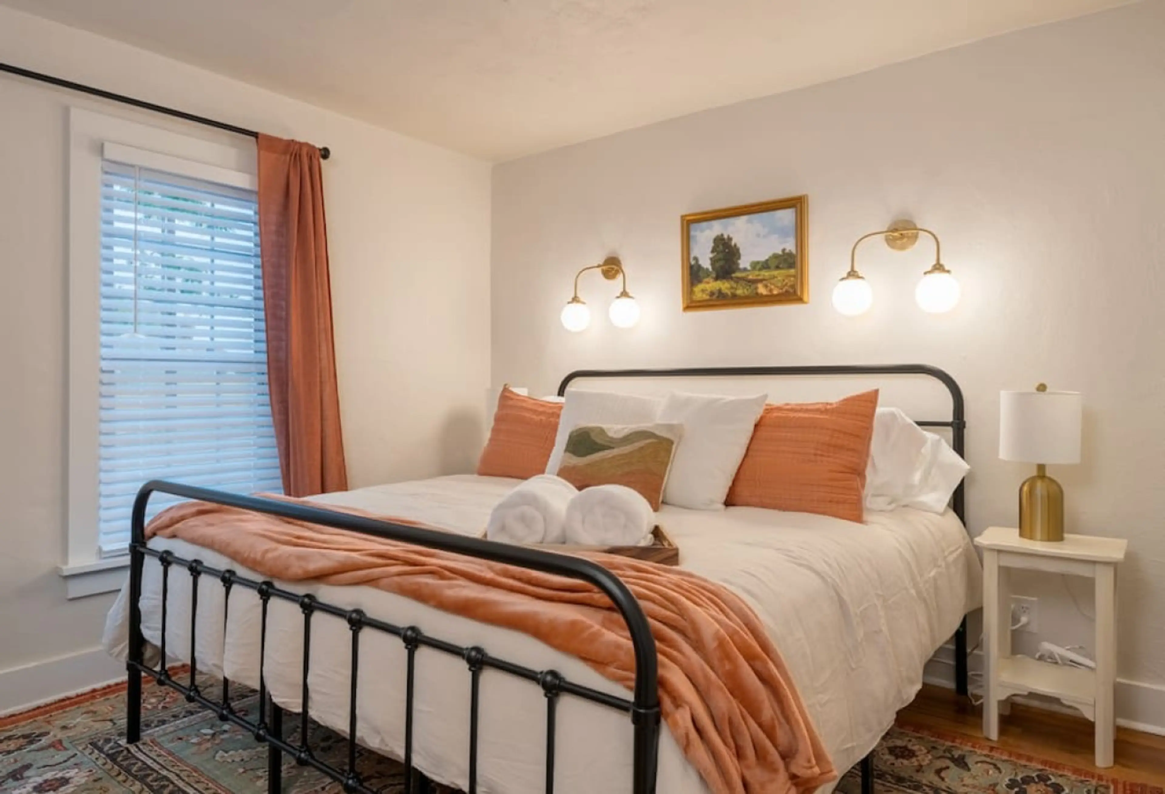 spacious bedroom with a king size bed