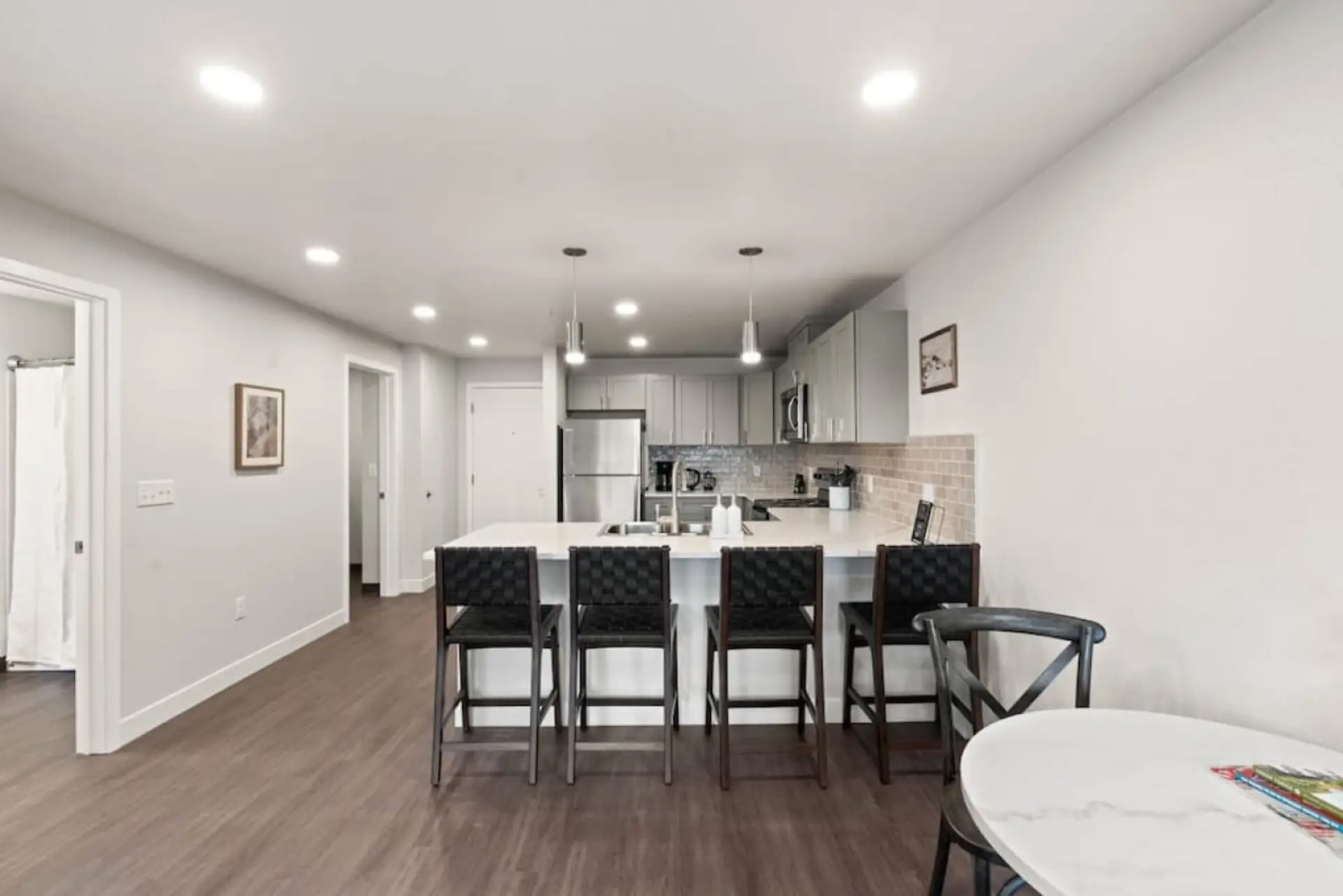Sleek, fully stocked kitchen with high-end appliances—perfect for home-cooked meals or morning coffee.