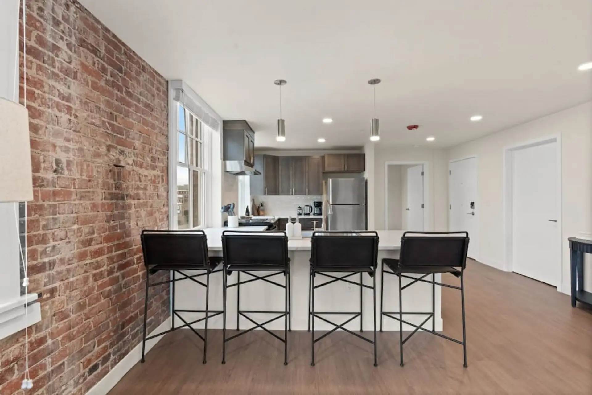 Sleek, fully stocked kitchen with high-end appliances—perfect for home-cooked meals or morning coffee.