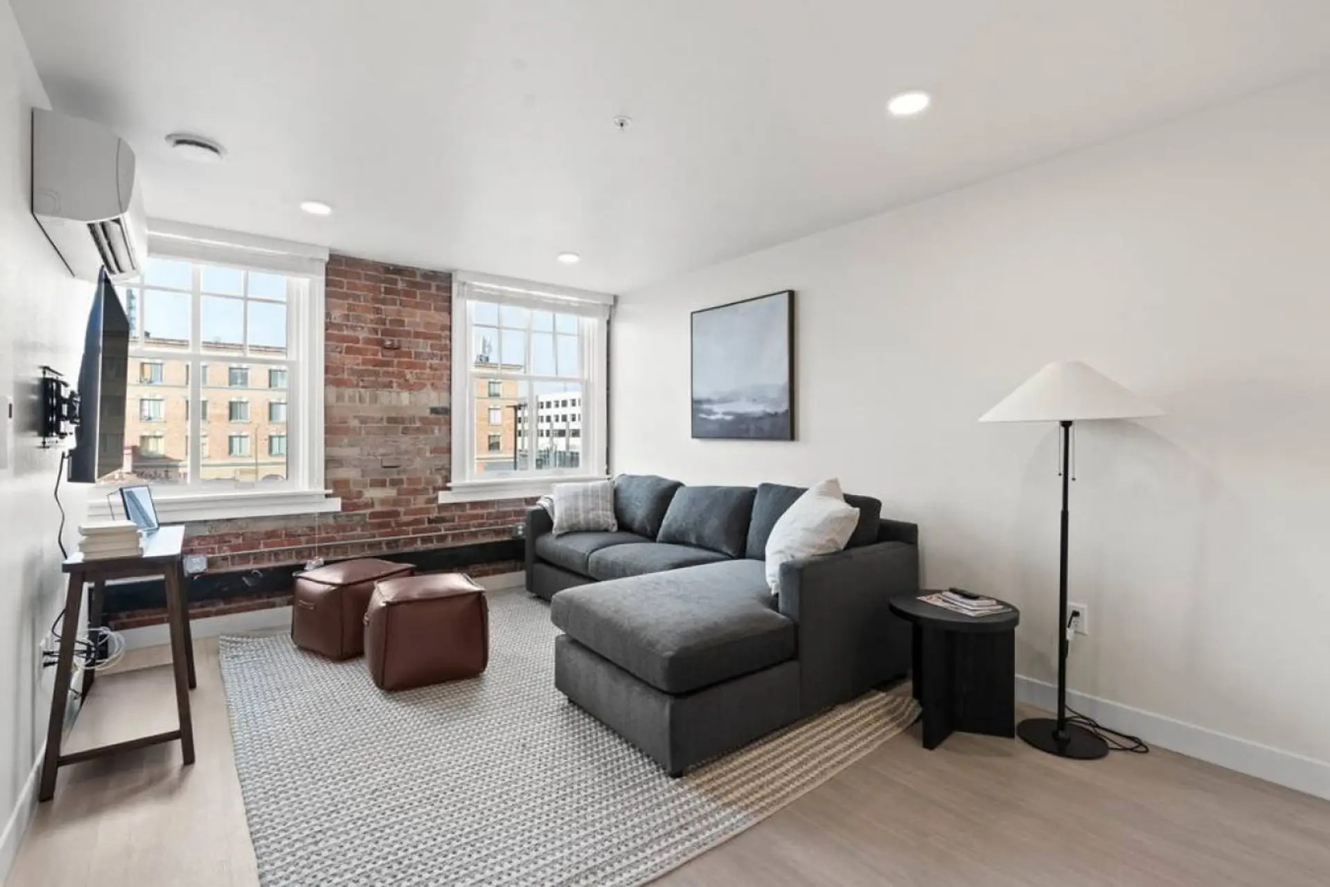 Relax in style—cozy seating with curated art and design accents.