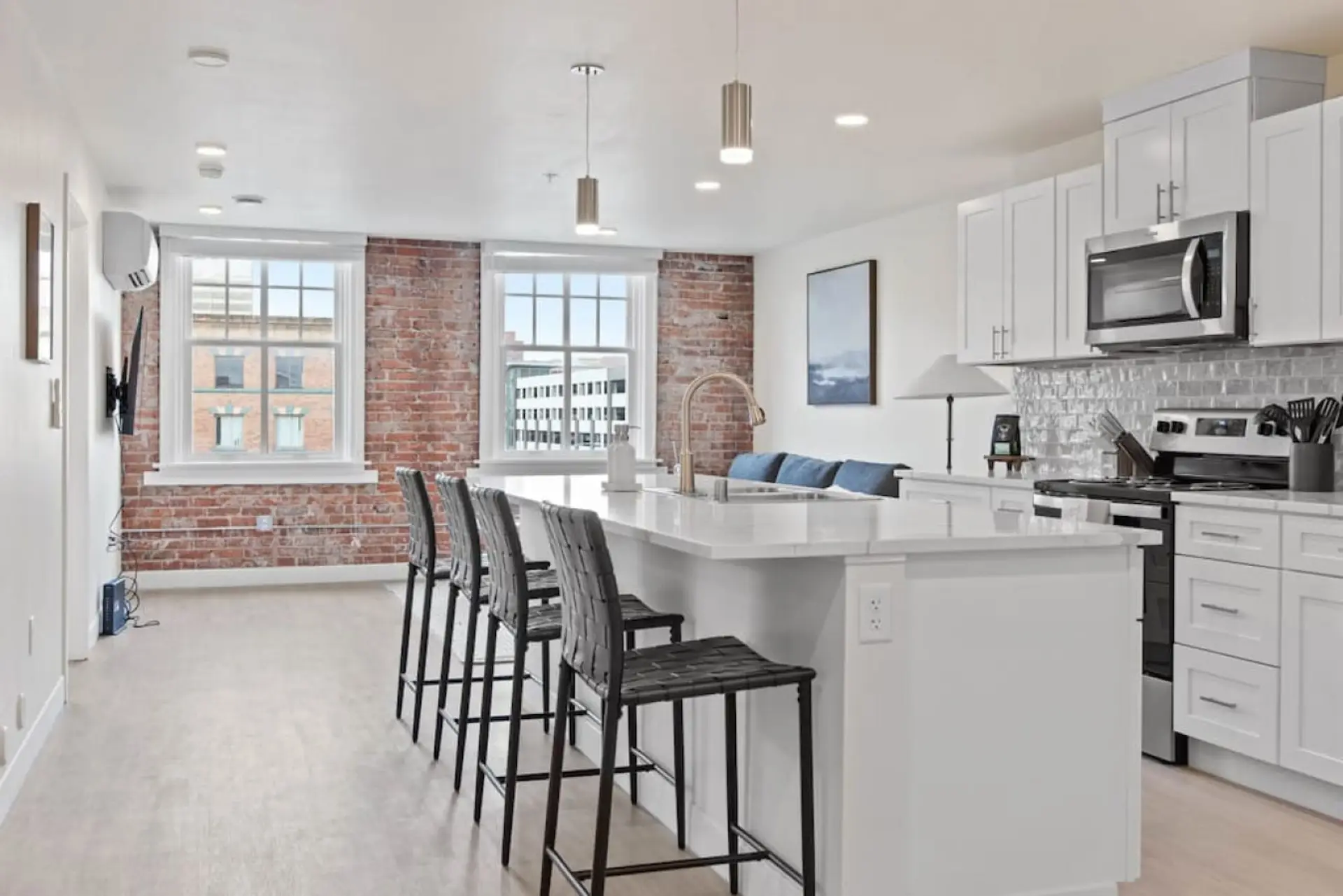Sleek, fully stocked kitchen with high-end appliances—perfect for home-cooked meals or morning coffee.