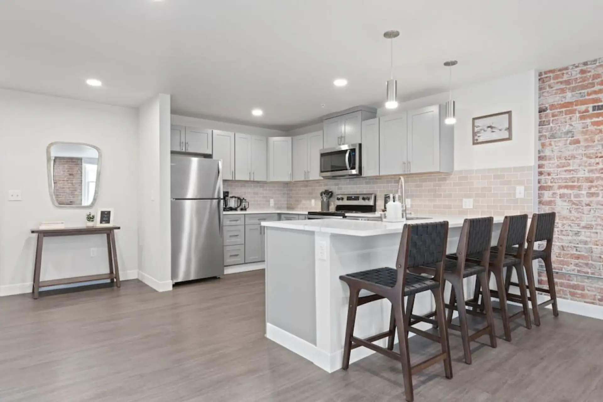 Sleek, fully stocked kitchen with high-end appliances—perfect for home-cooked meals or morning coffee.