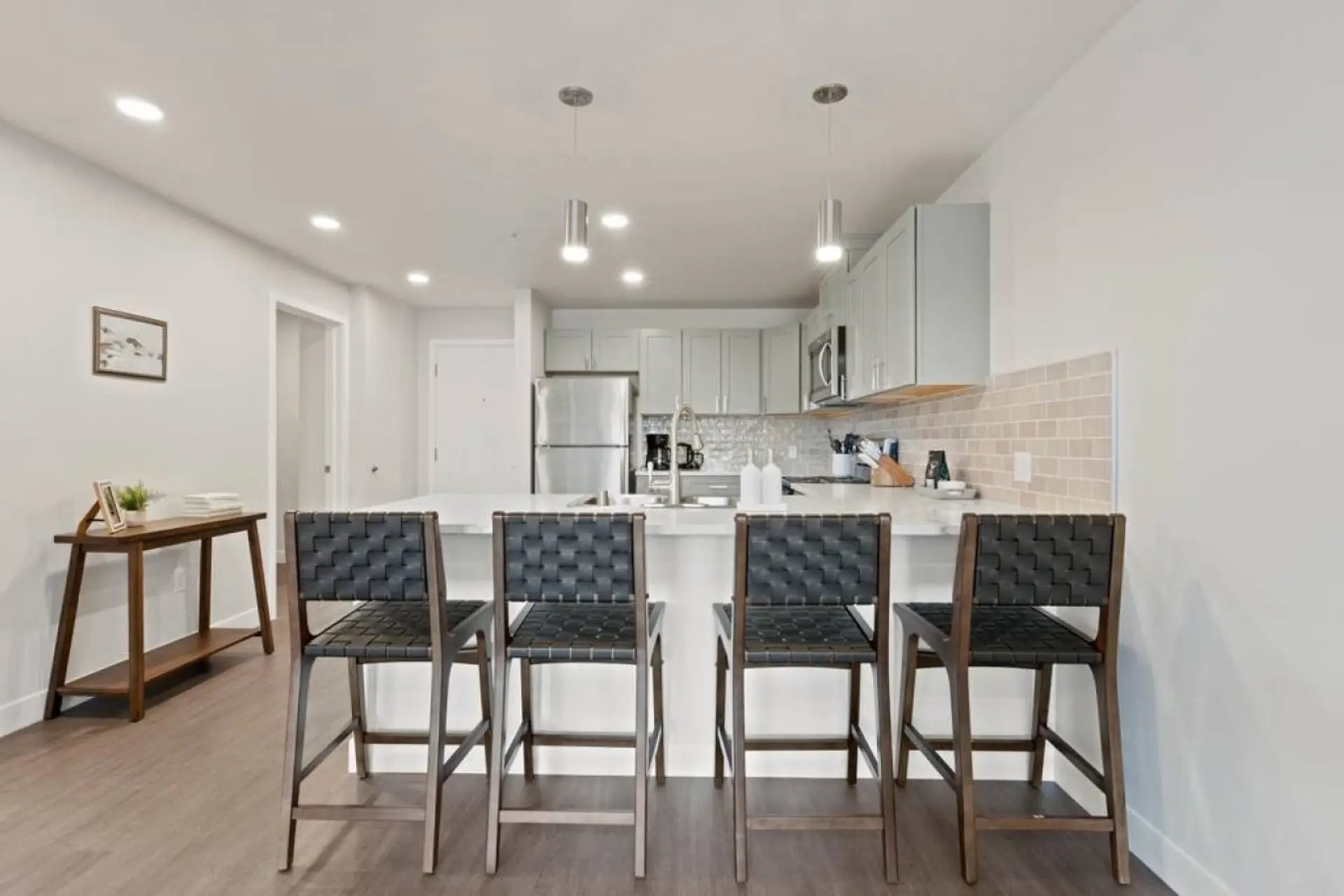 Sleek, fully stocked kitchen with high-end appliances—perfect for home-cooked meals or morning coffee.