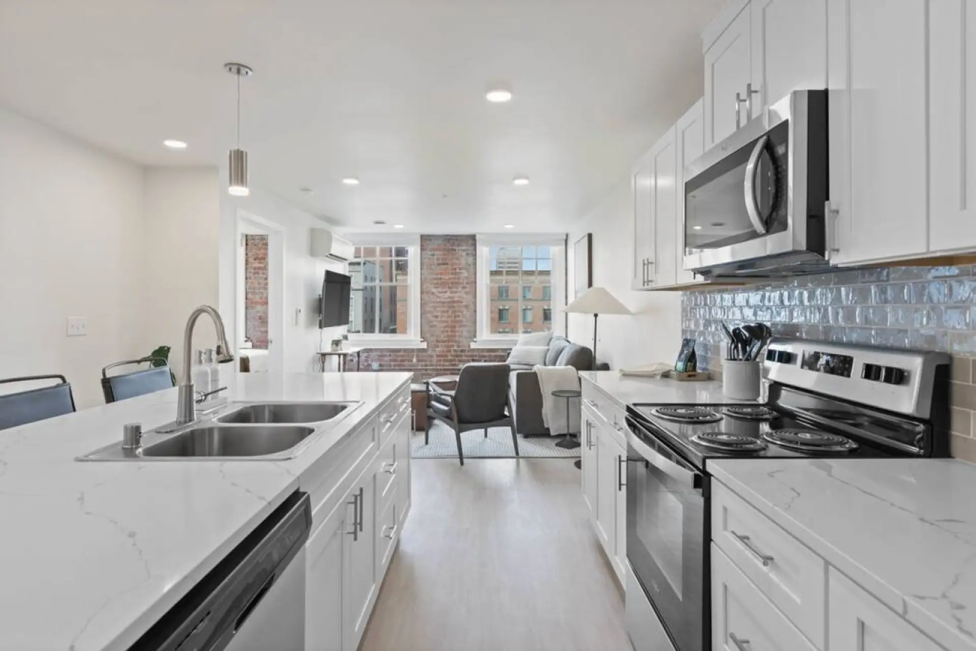 Sleek, fully stocked kitchen with high-end appliances—perfect for home-cooked meals or morning coffee.