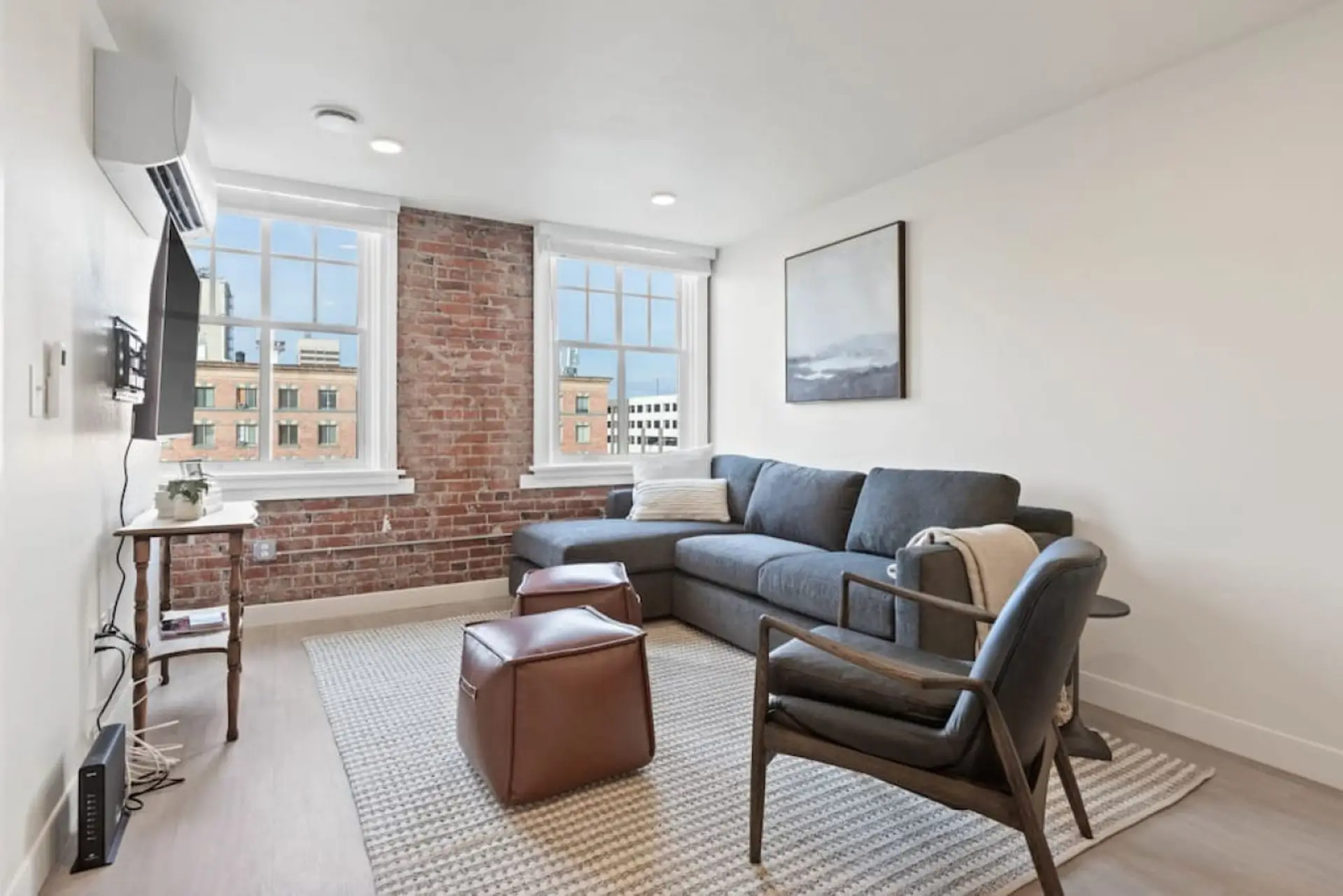 Relax in style—cozy seating with curated art and design accents.