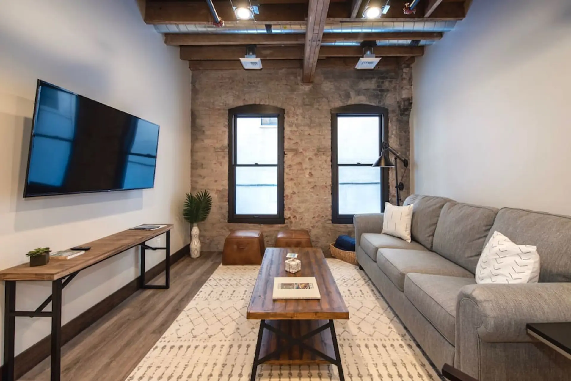 Relax in style—cozy seating with curated art and design accents.