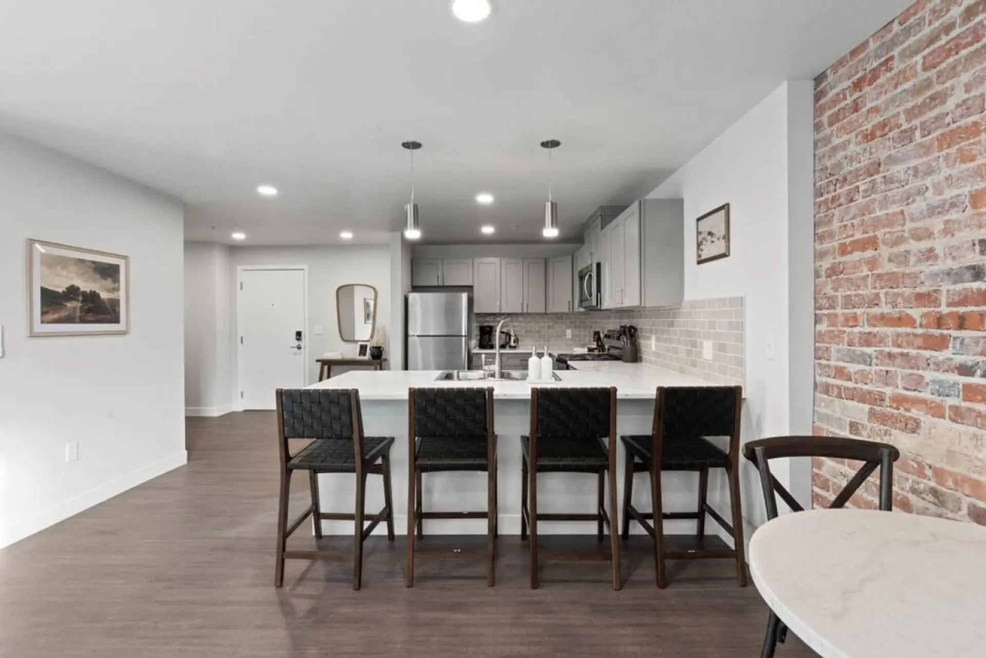 Sleek, fully stocked kitchen with high-end appliances—perfect for home-cooked meals or morning coffee.