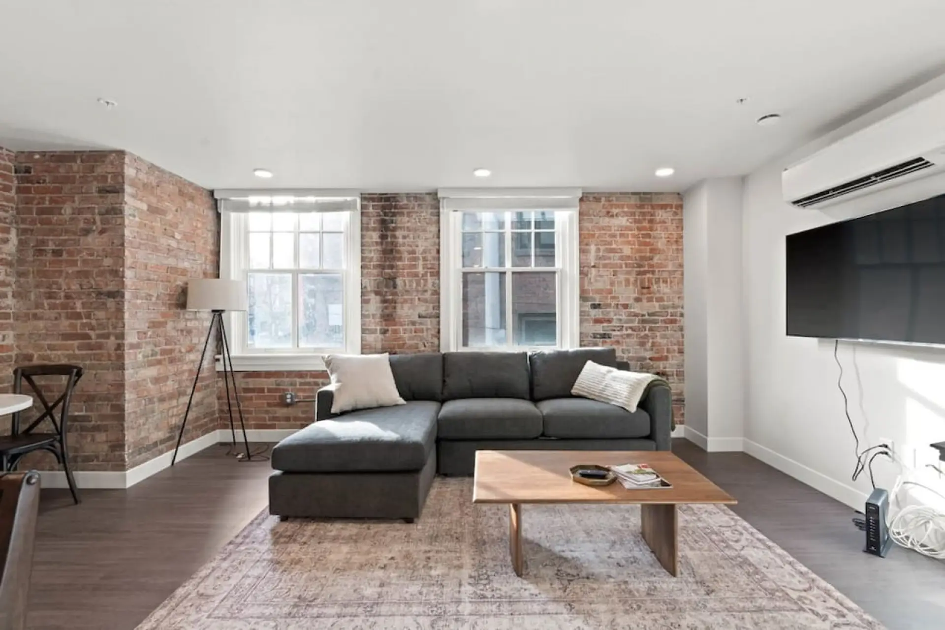 Relax in style—cozy seating with curated art and design accents.