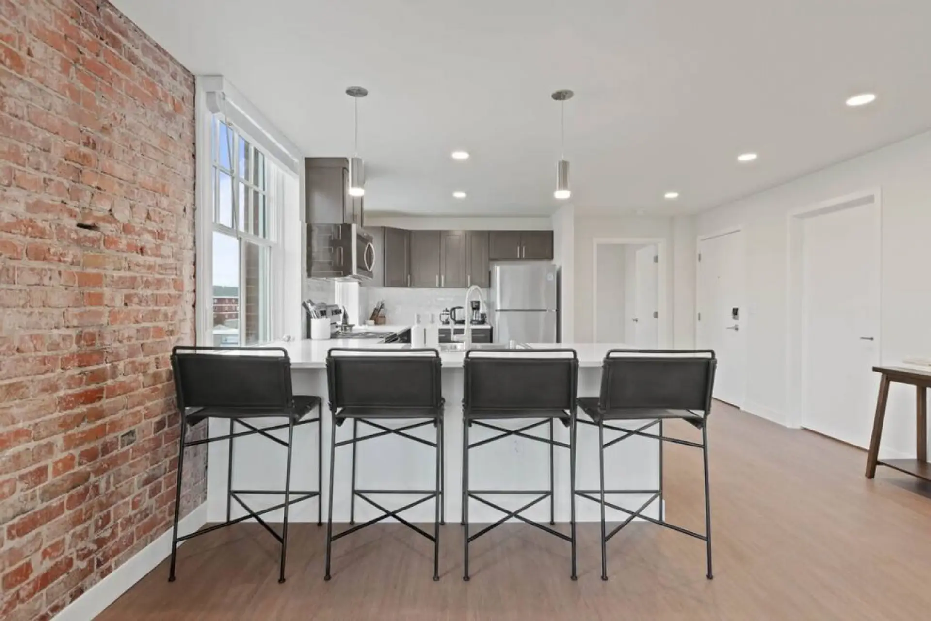 Sleek, fully stocked kitchen with high-end appliances—perfect for home-cooked meals or morning coffee.