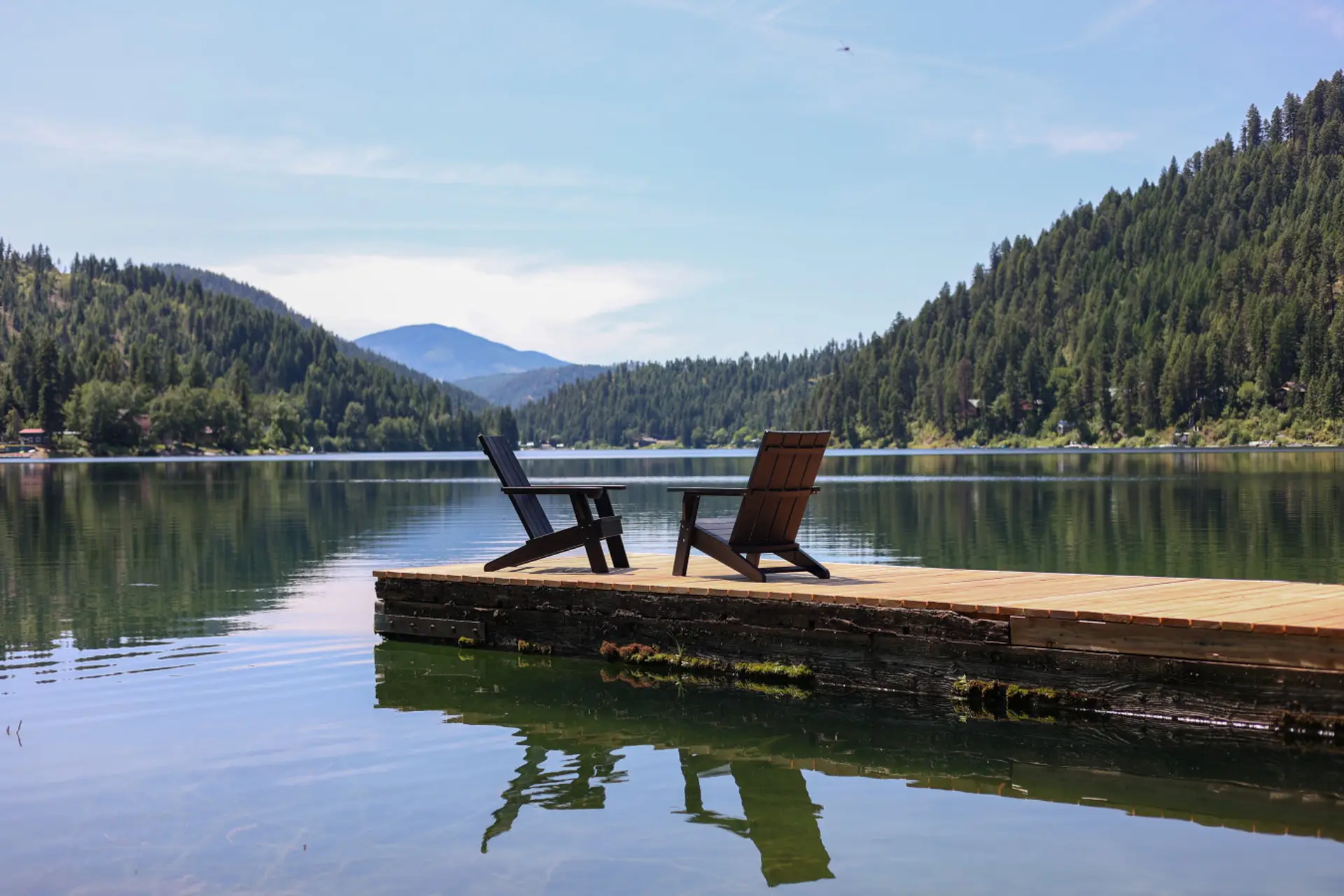 A quiet dock overlooking calm lake waters.