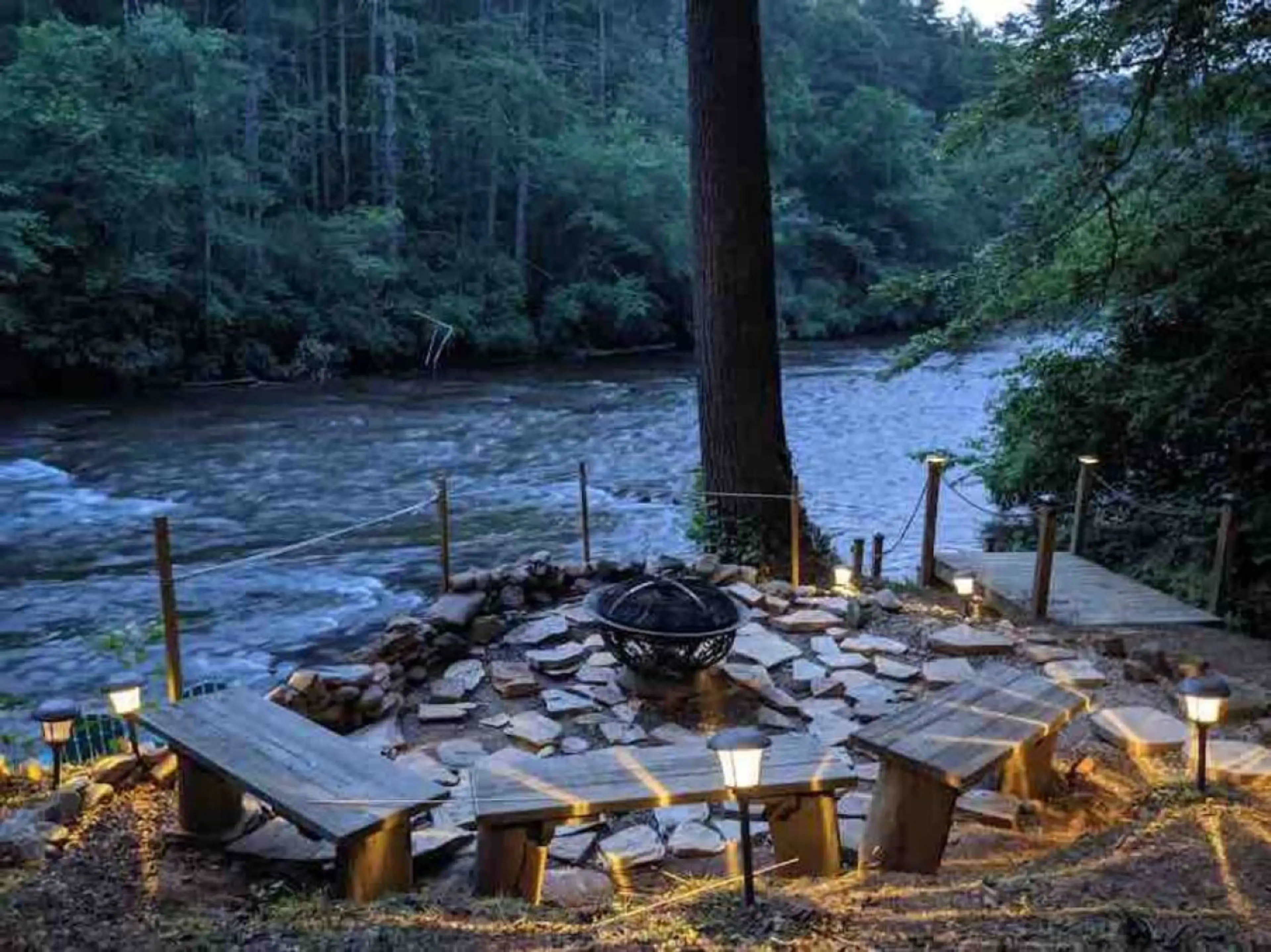 Relax by the fire pit and enjoy the peaceful charm of the riverside.