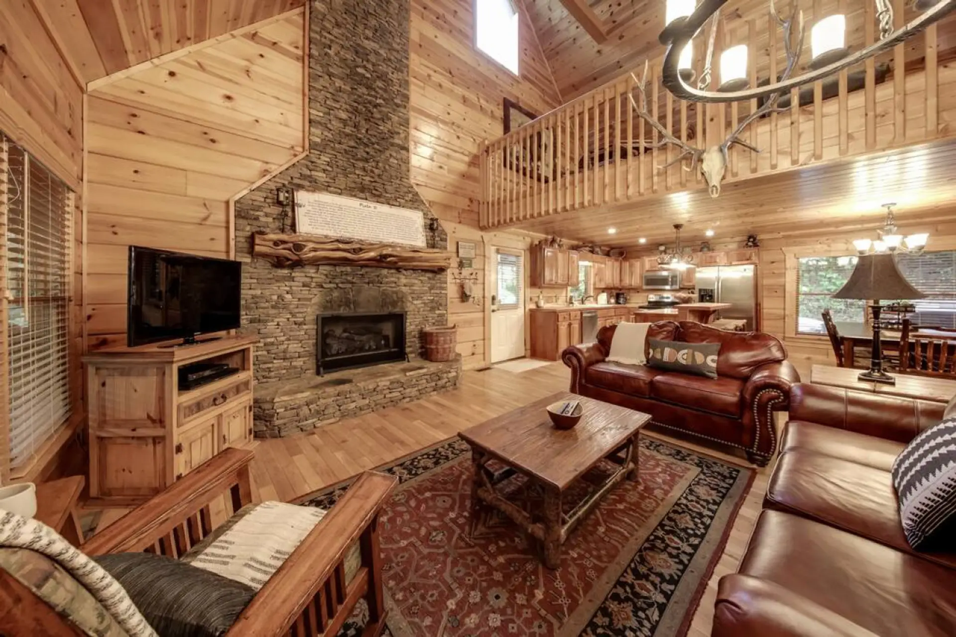 Relax in an open-concept living space centered around a stunning fireplace.