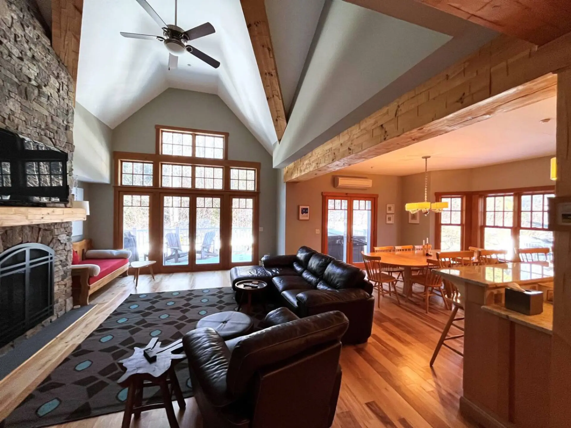 Soaring Cathedral ceiling in family room which opens up to dining room and Kitchen. Wood burning fireplace