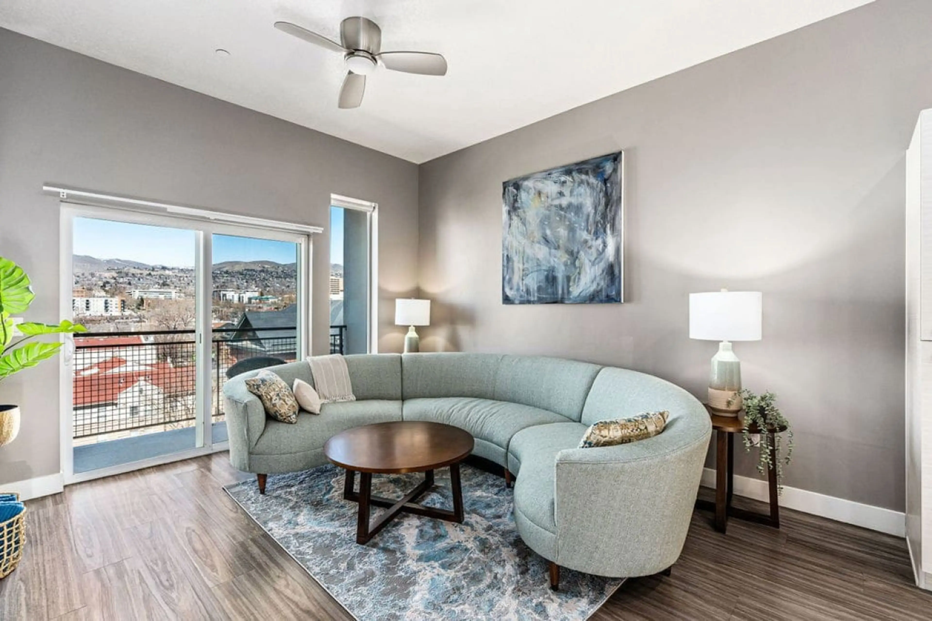 Gorgeous Livingroom, 65" TV, Comfy couch. Beautiful views off your patio.