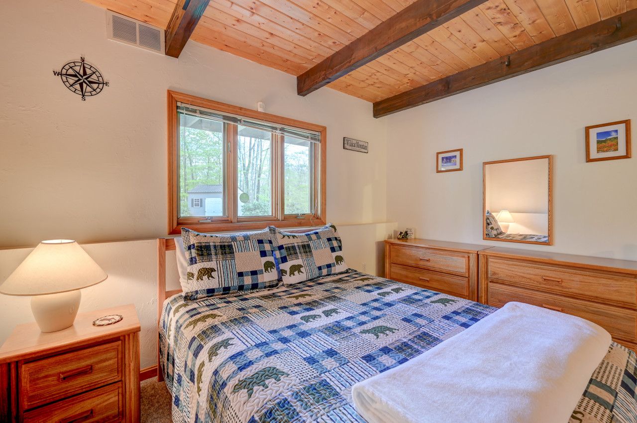 Second bedroom with queen bed and ample storage
