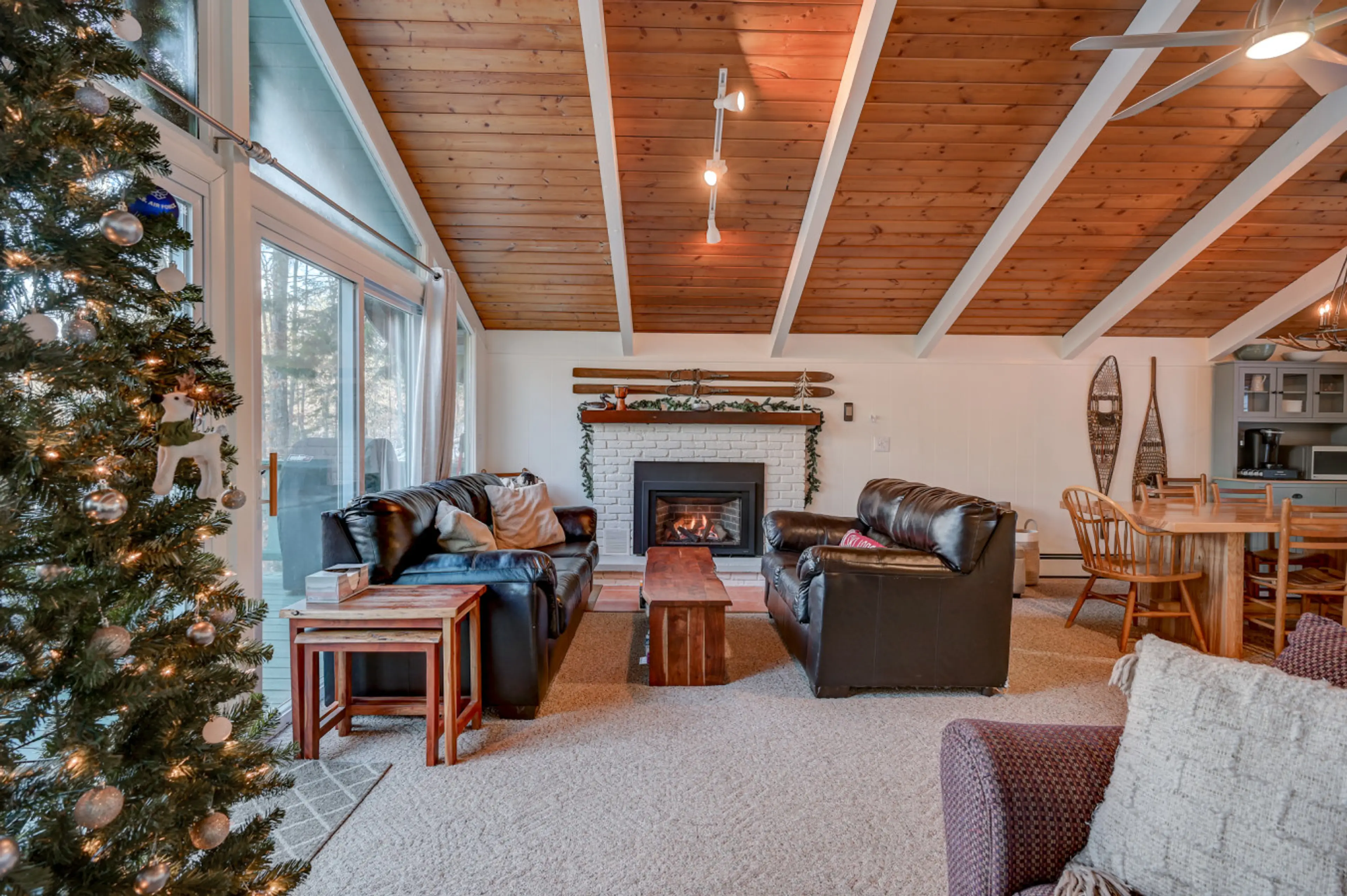 Open floor plan chalet with a gas fireplace