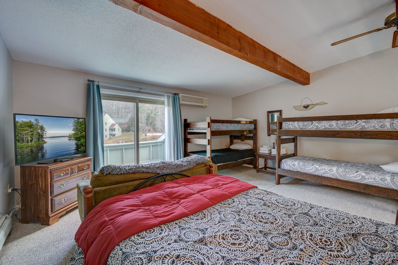 Third bedroom in our upstairs loft that includes a full bed and two sets of bunk beds.  We also have a couch, TV, and a walk-out deck.