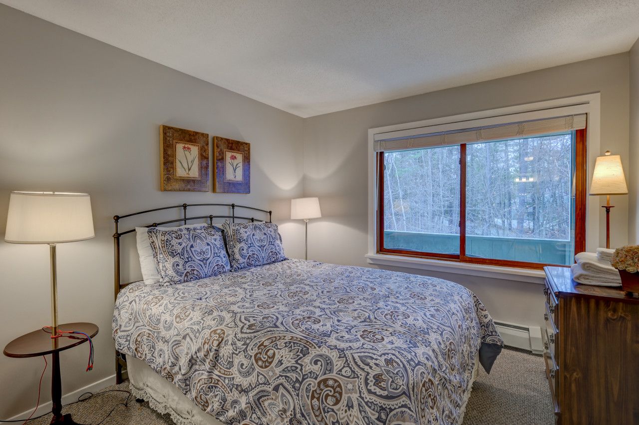 Second bedroom with a queen bed with a full bathroom across the hall