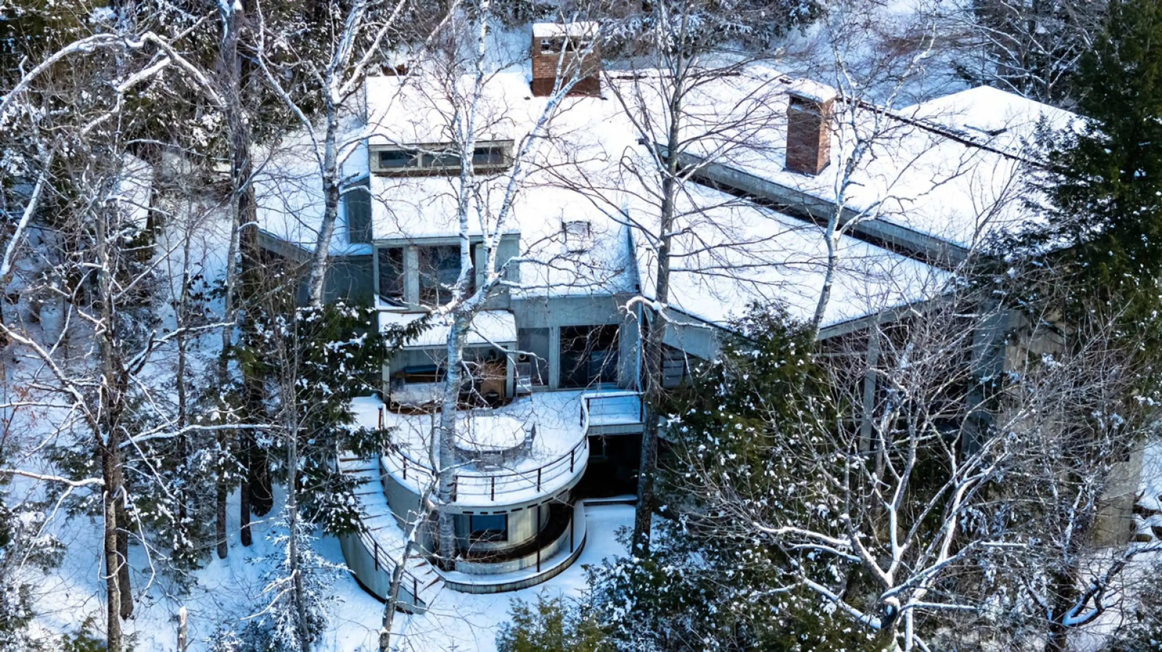 Retreat to this White Mountain contemporary nestled above the Ellis River in Jackson, New Hampshire