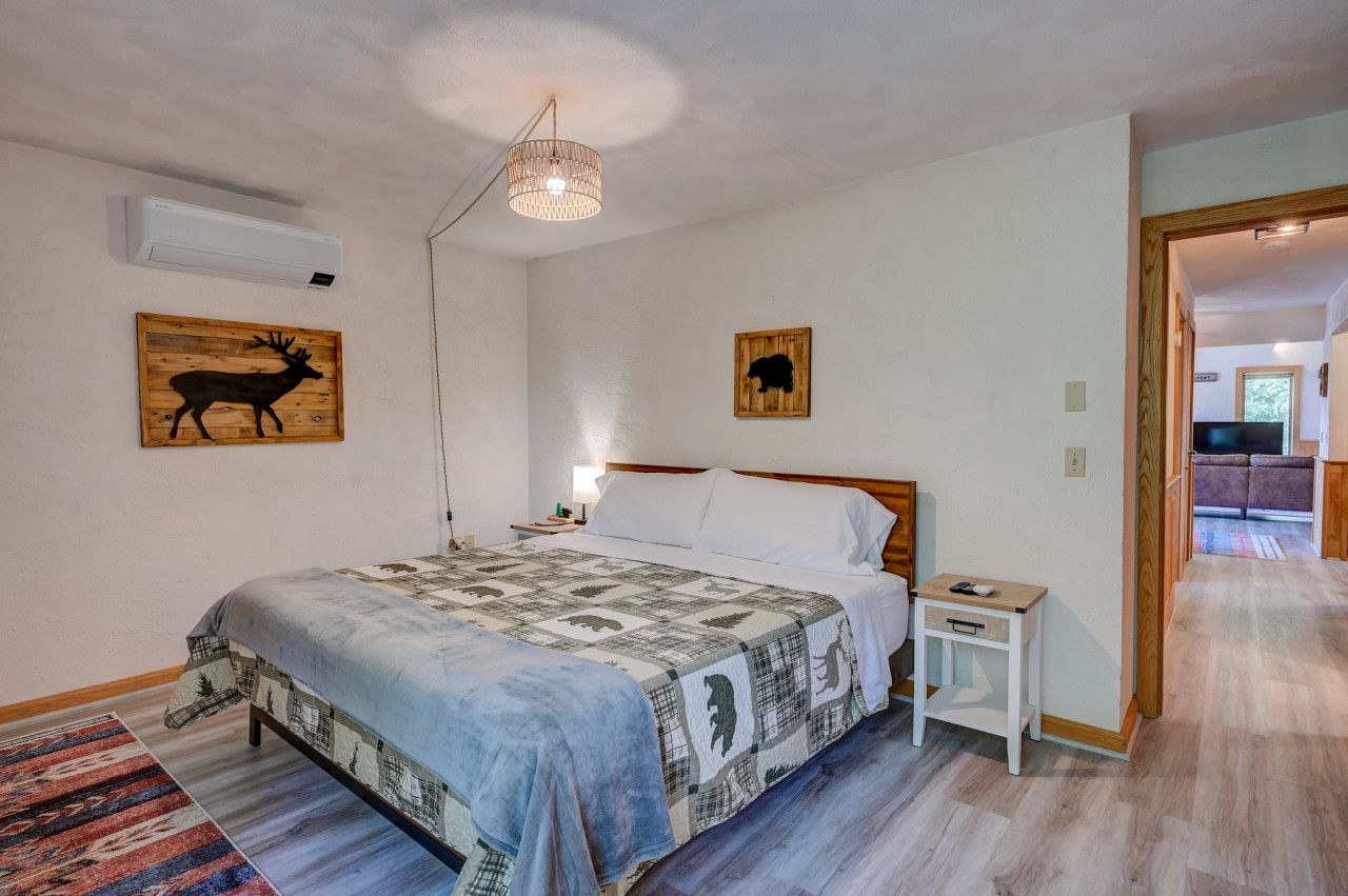 King bed w/ attached private full-bathroom on the main floor along with AC and TV