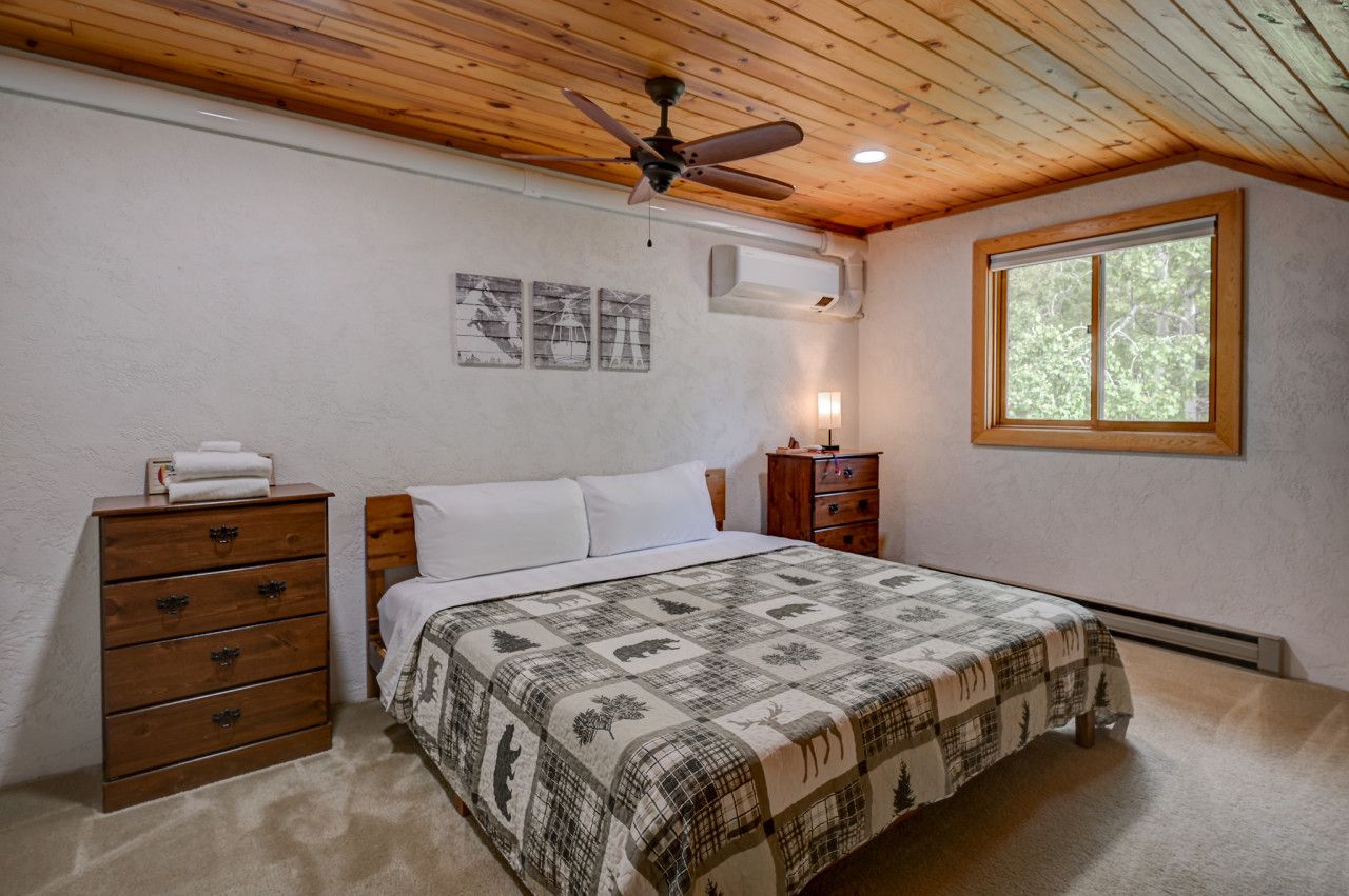 King bed located upstairs with AC and TV