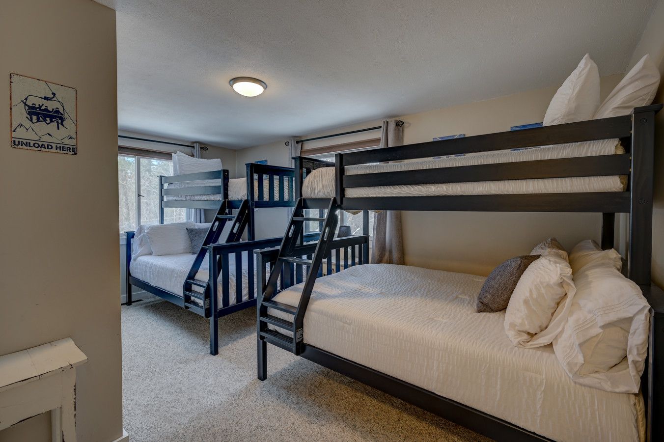 Our third bedroom has 2 bunk beds, both being a twin over full located on the main floor