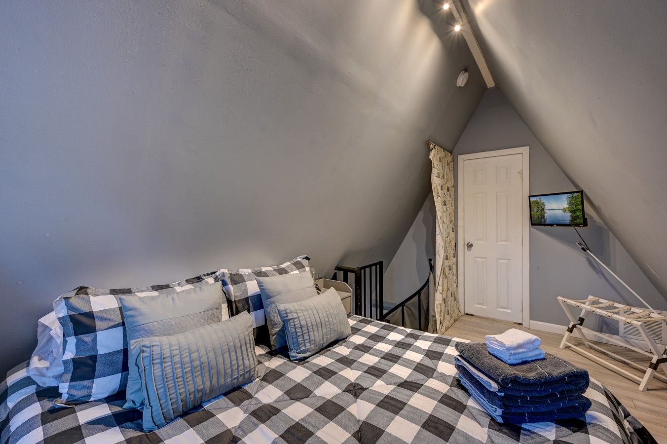 Queen bed located upstairs