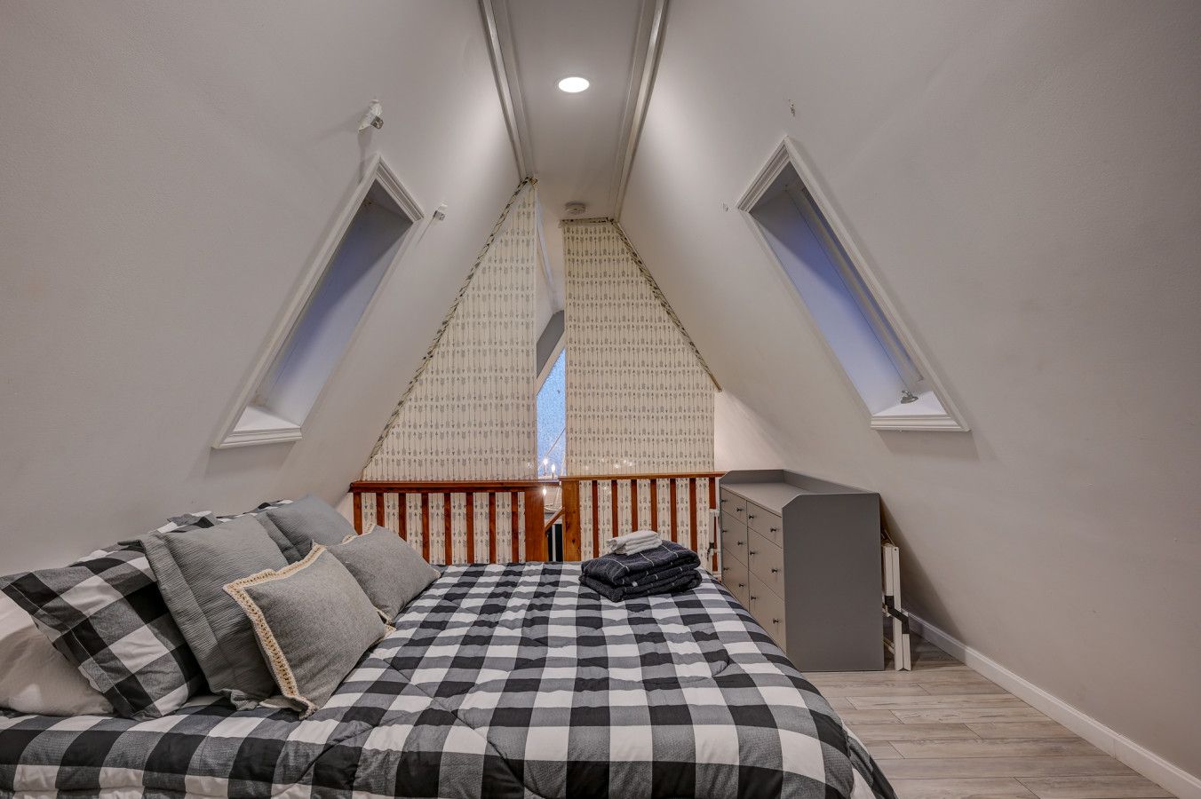 Queen bed located upstairs