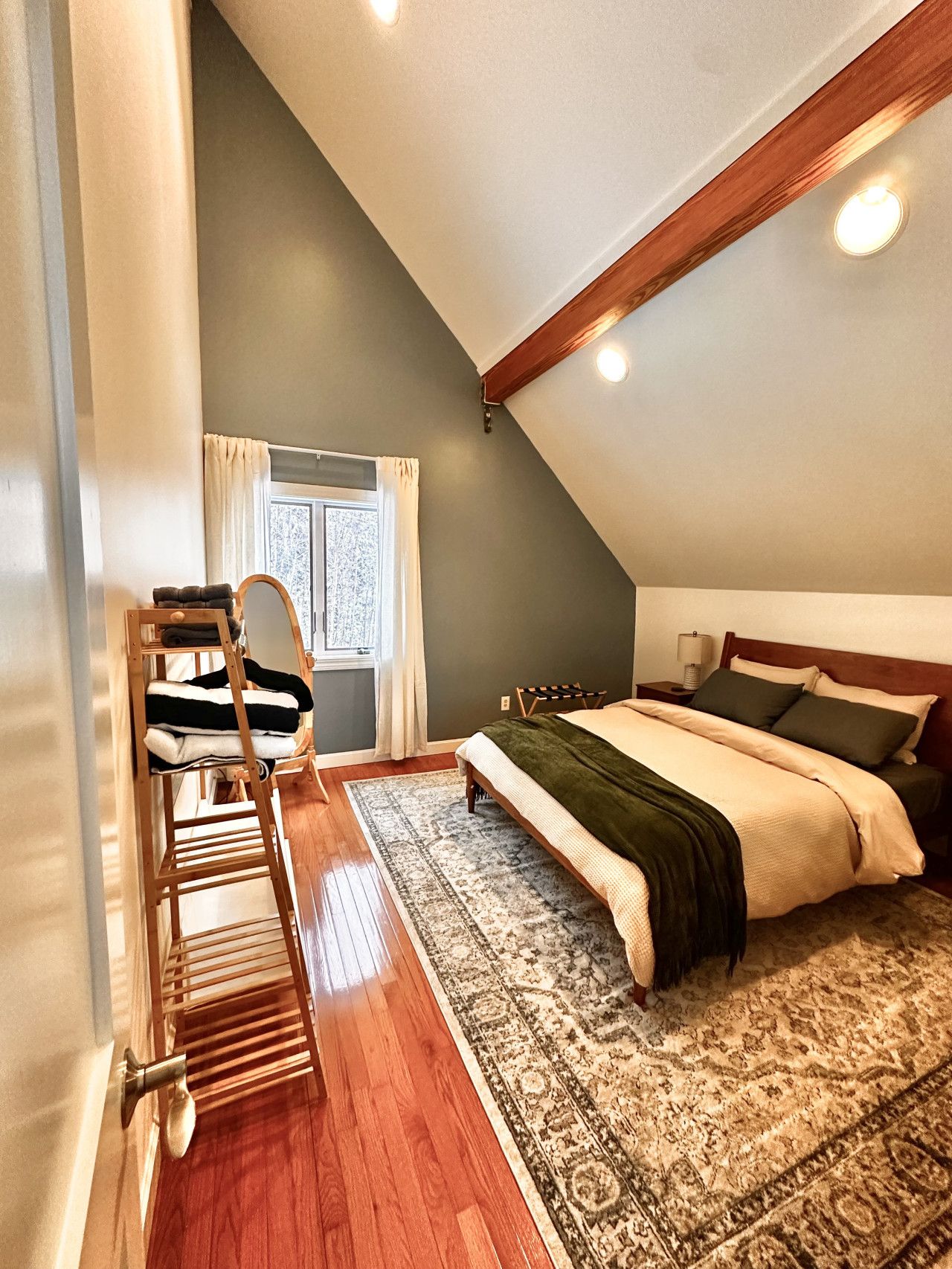 Queen bed on the upstairs floor