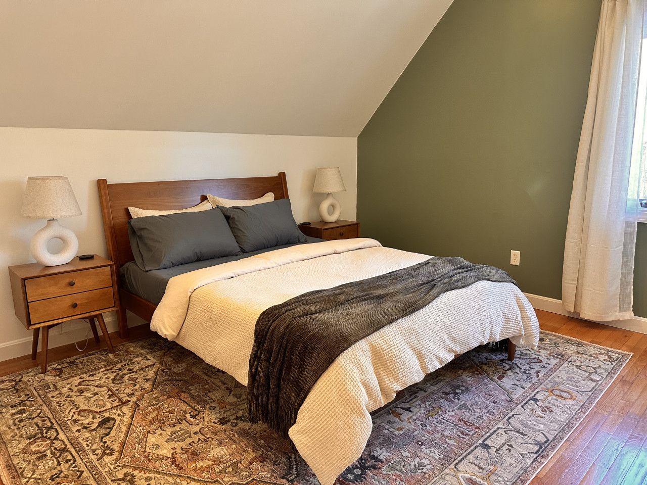 Queen bed on the upstairs floor